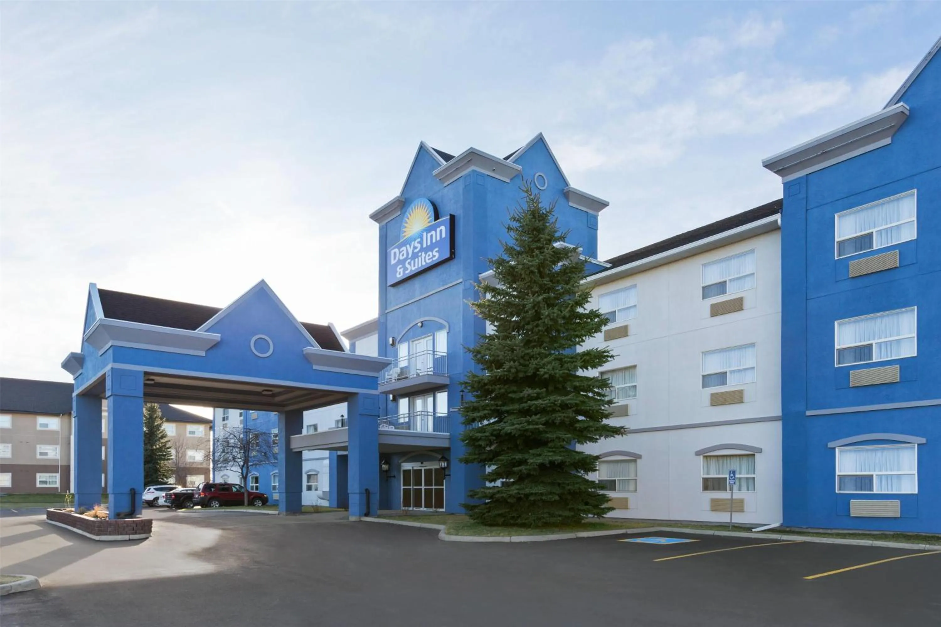 Property building in Days Inn & Suites by Wyndham Brooks