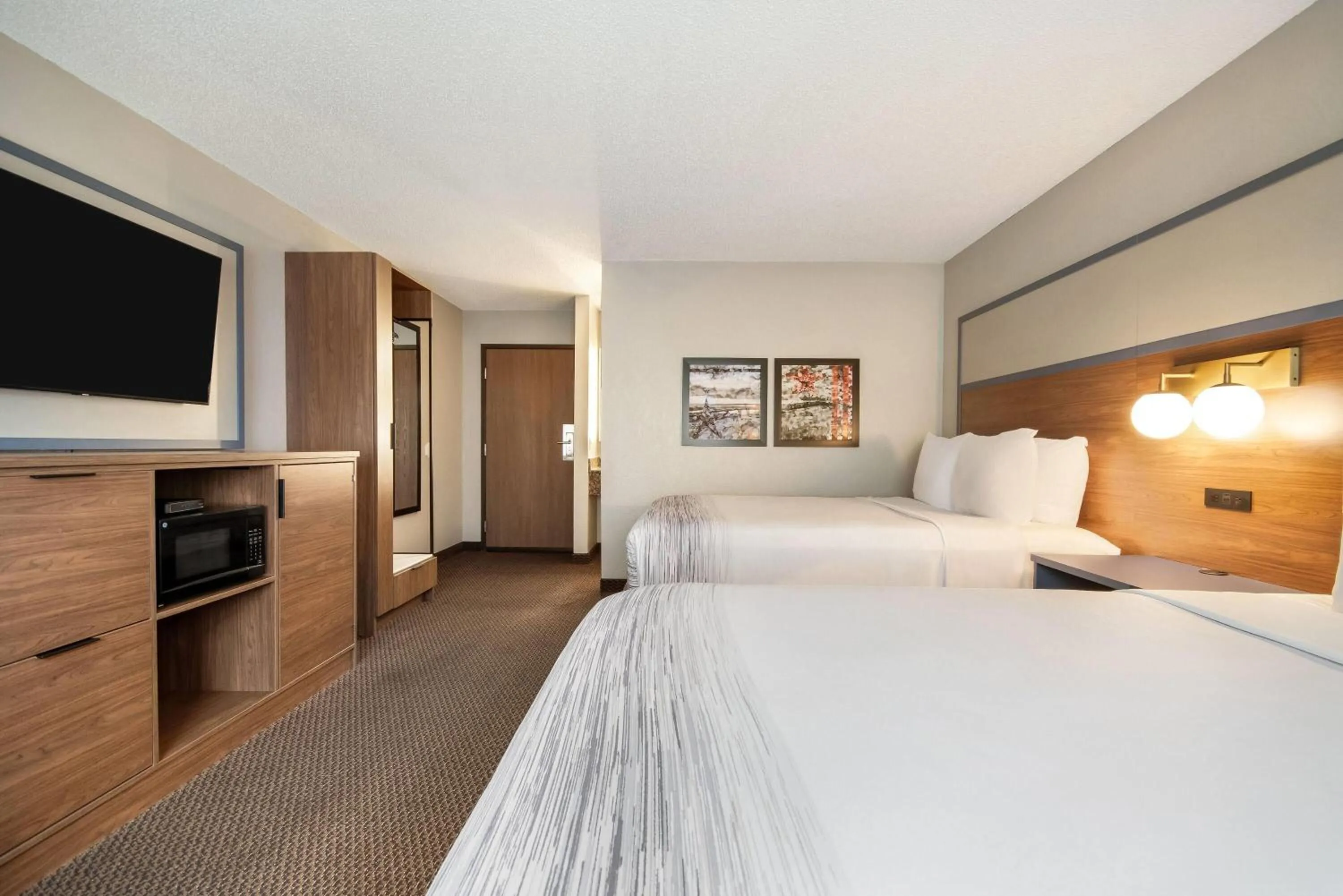 Bed in AmericInn by Wyndham St. Peter