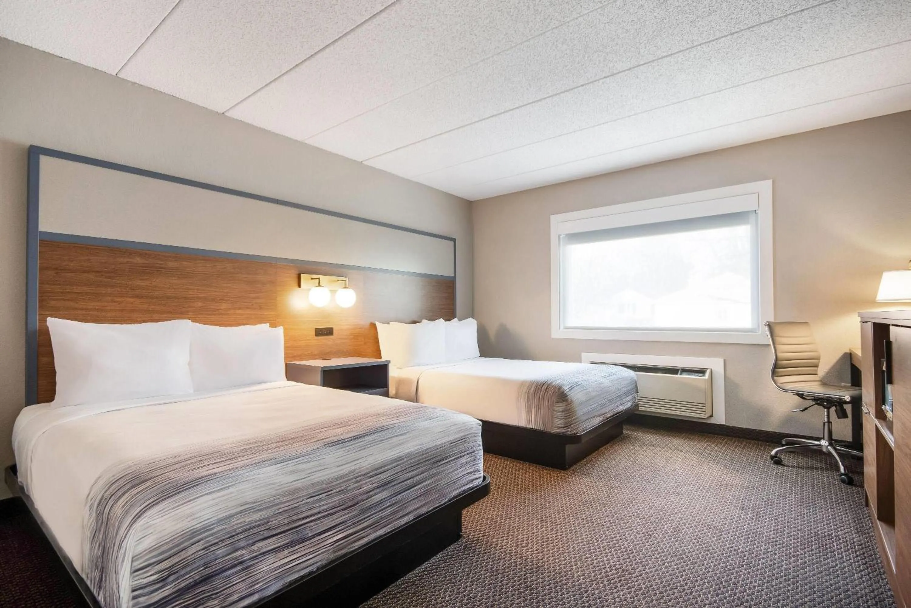 Bed in AmericInn by Wyndham St. Peter