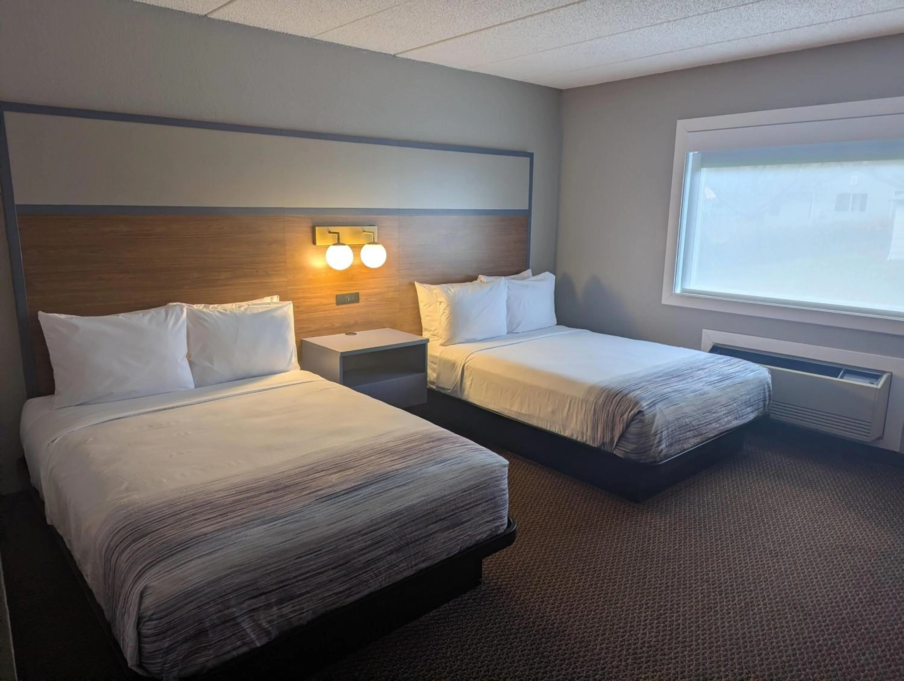 Photo of the whole room, Bed in AmericInn by Wyndham St. Peter