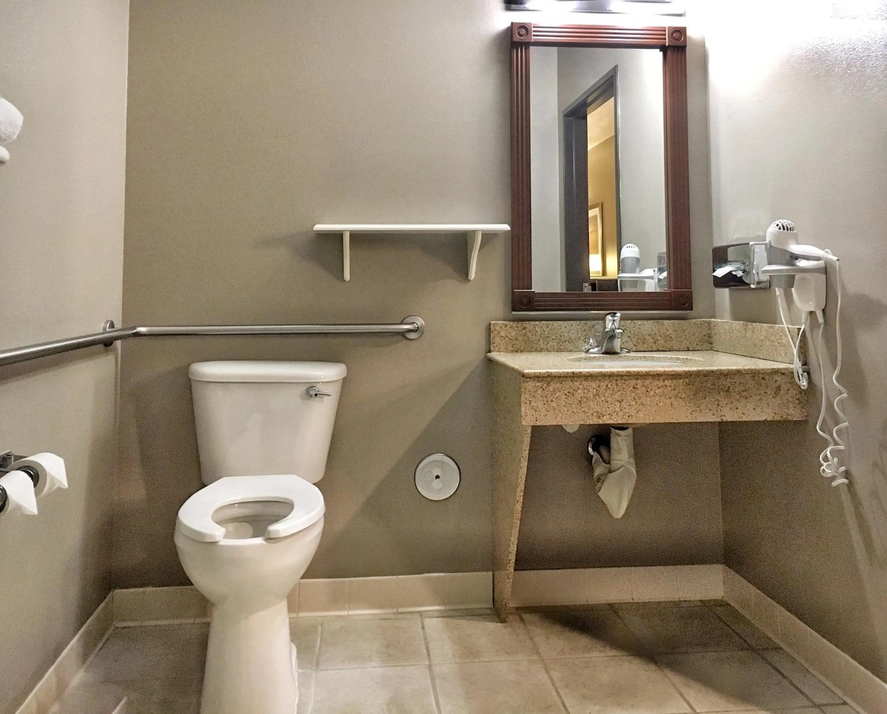 Toilet in Best Western Wheatland Inn