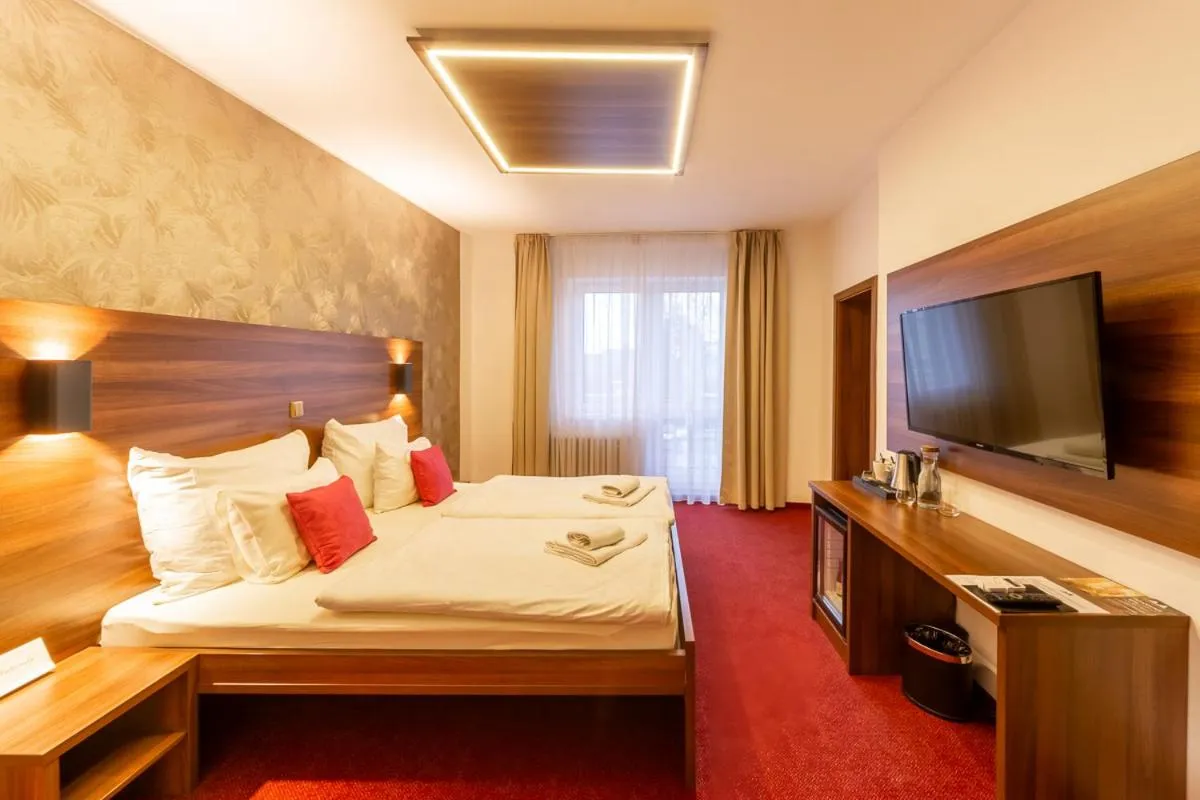 Bed in Bohemia Inn Hotel