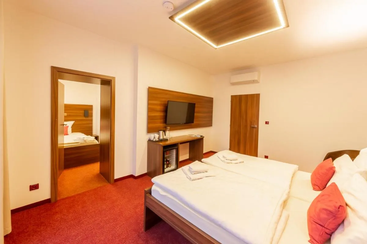 Bed in Bohemia Inn Hotel