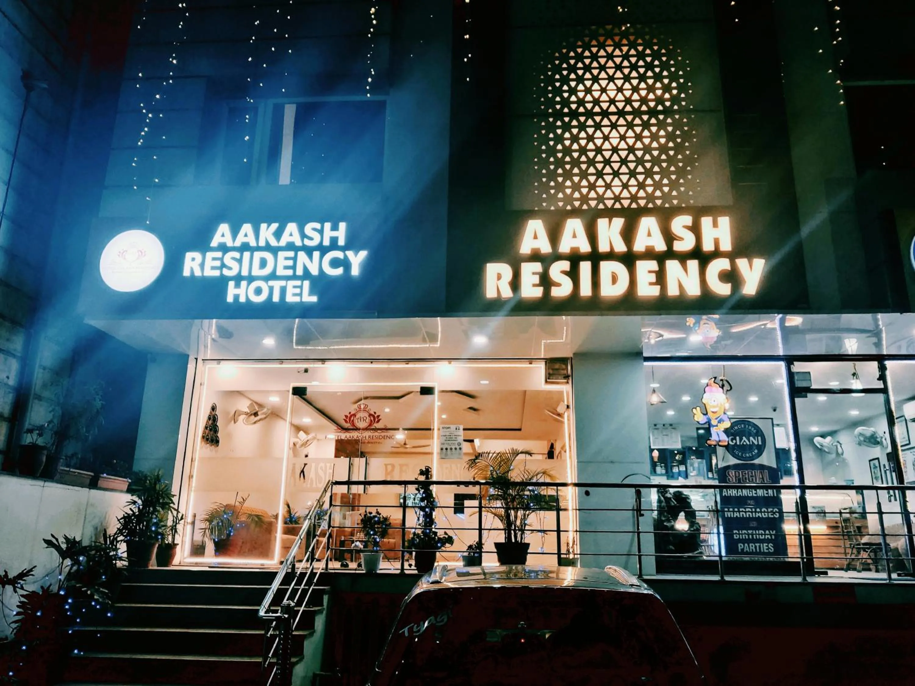 Property logo or sign in Hotel Aakash Residency