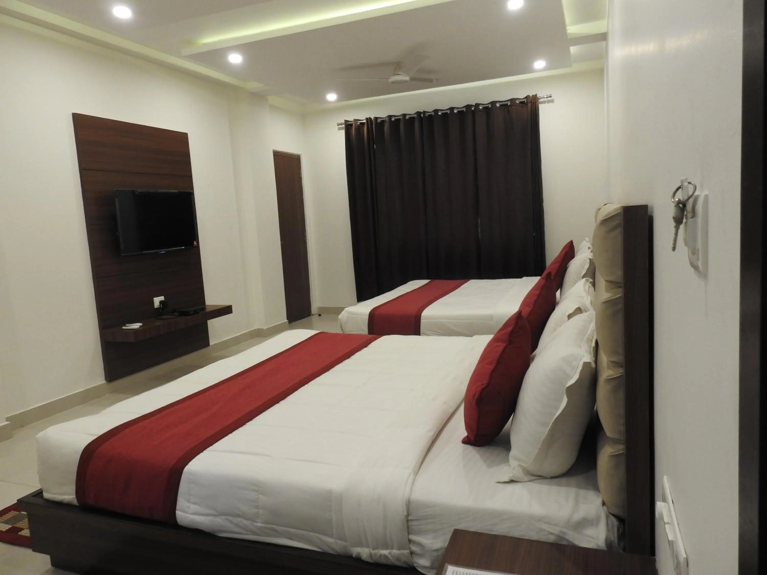 Bedroom in Hotel Aakash Residency