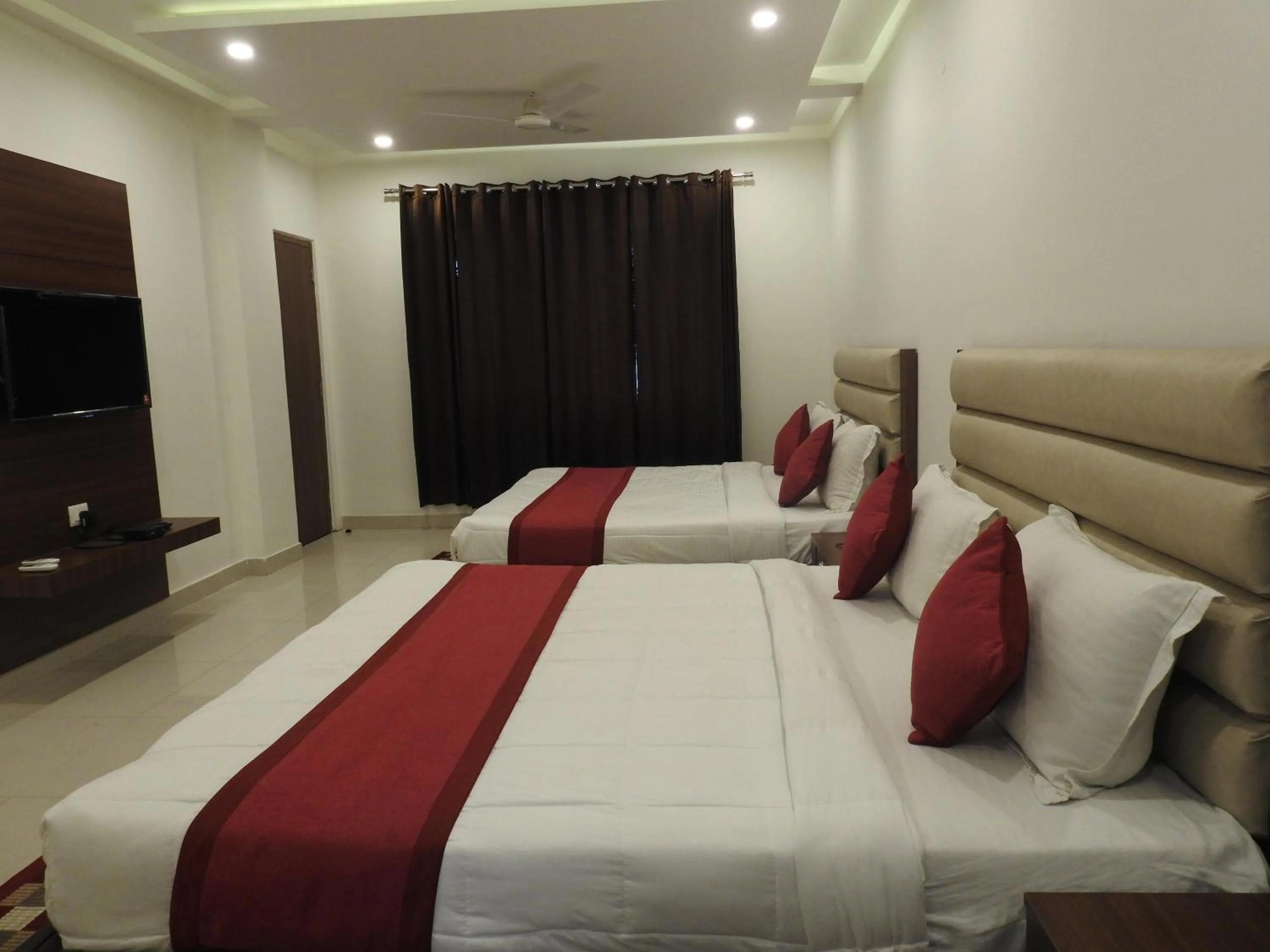 Bedroom in Hotel Aakash Residency