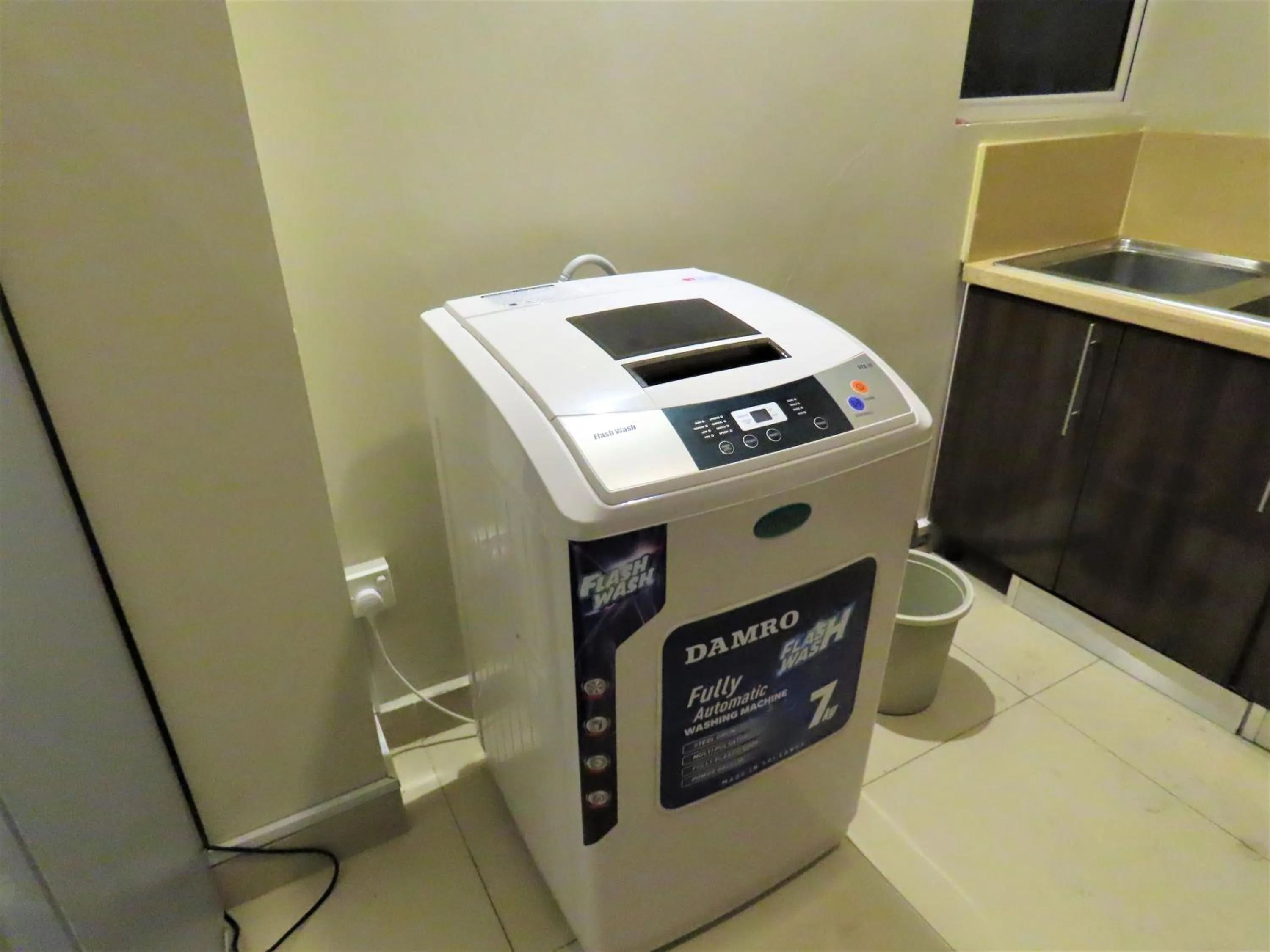 washing machine in VIVAS Residencies Luxury Apartments