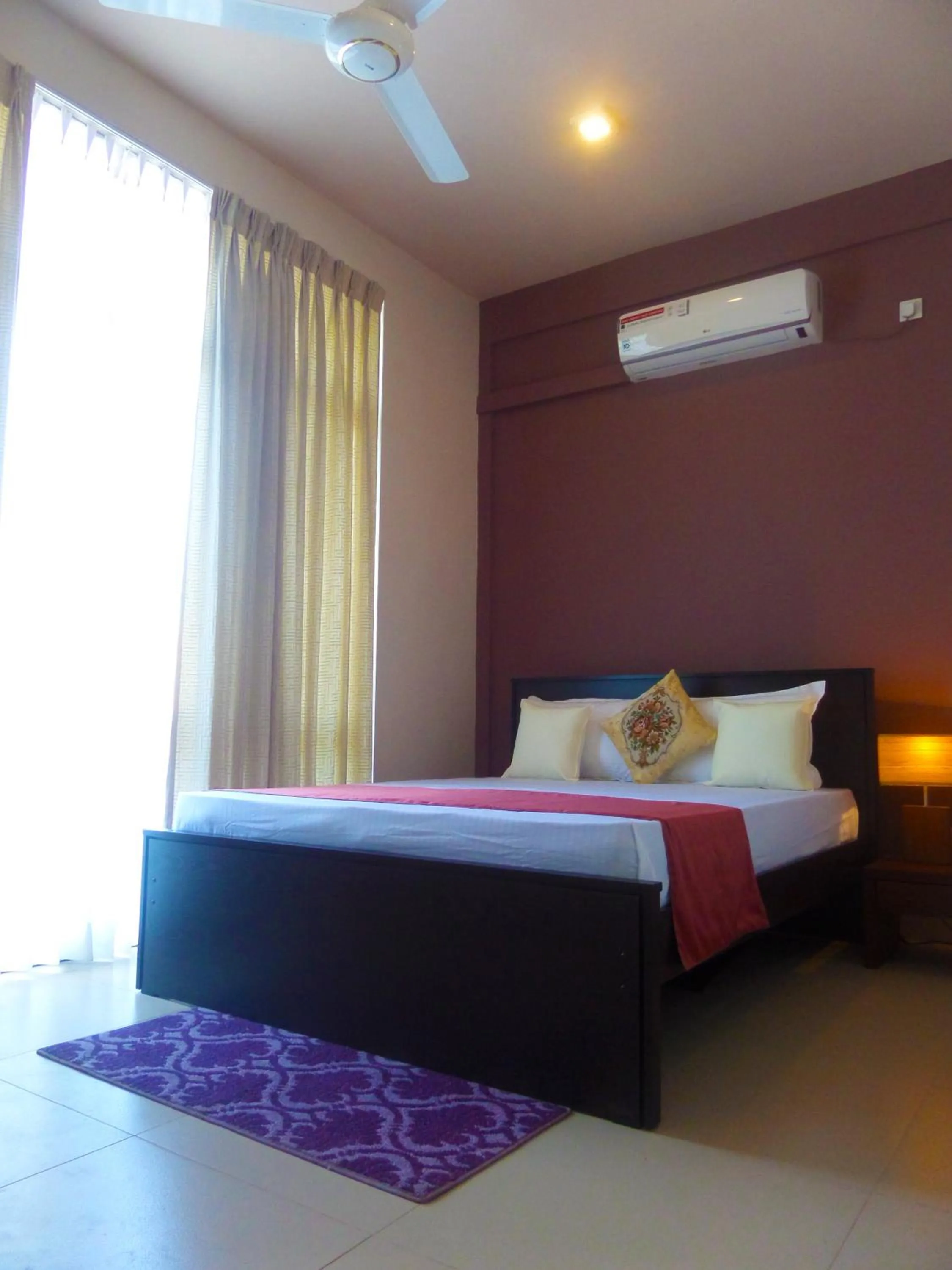 Bed in VIVAS Residencies Luxury Apartments