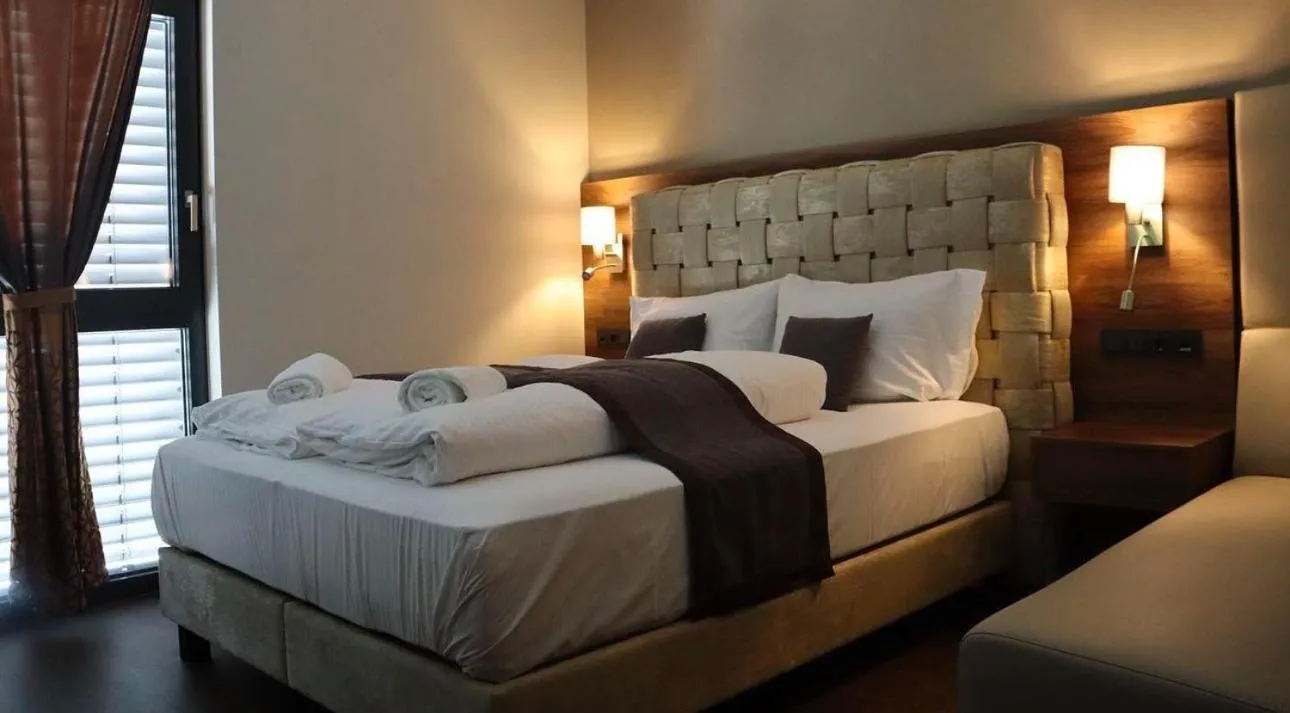 Photo of the whole room, Bed in Intergroup Business & Design Hotel Ingolstadt