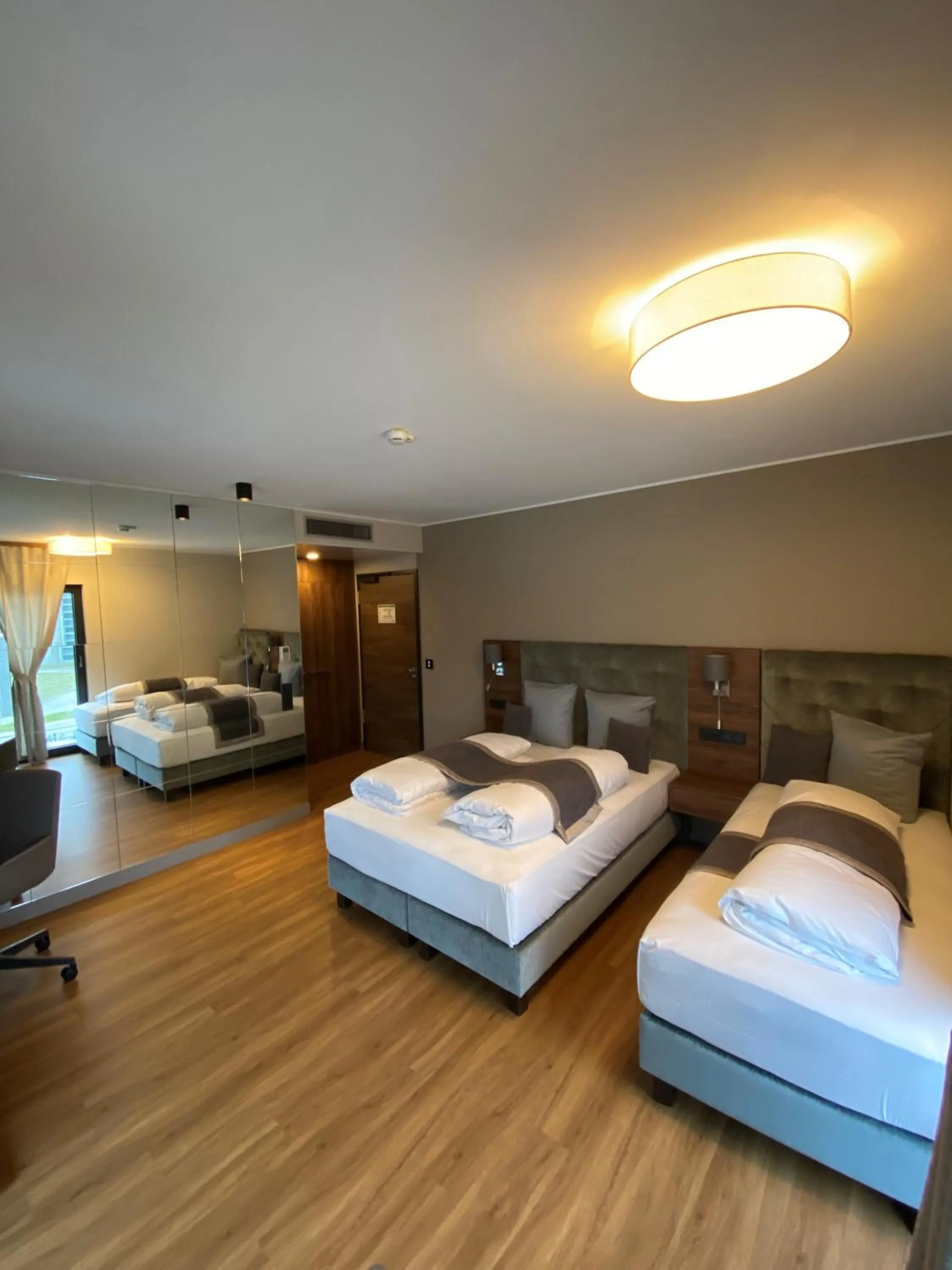 Photo of the whole room, Bed in Intergroup Business & Design Hotel Ingolstadt