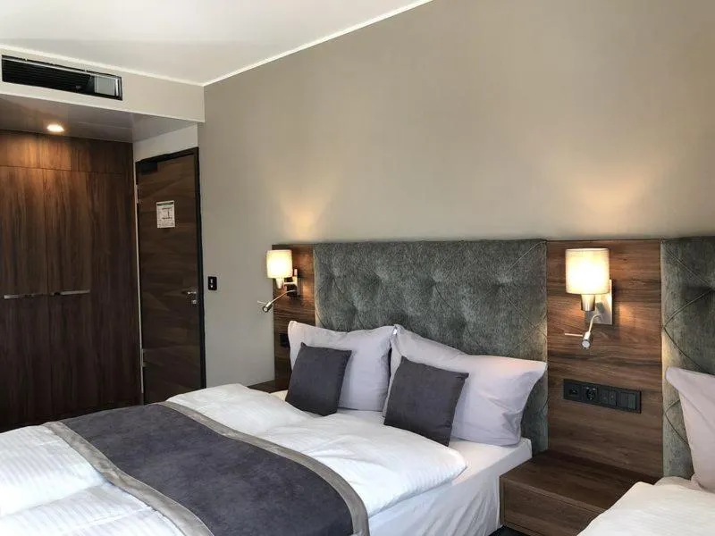 Photo of the whole room, Bed in Intergroup Business & Design Hotel Ingolstadt