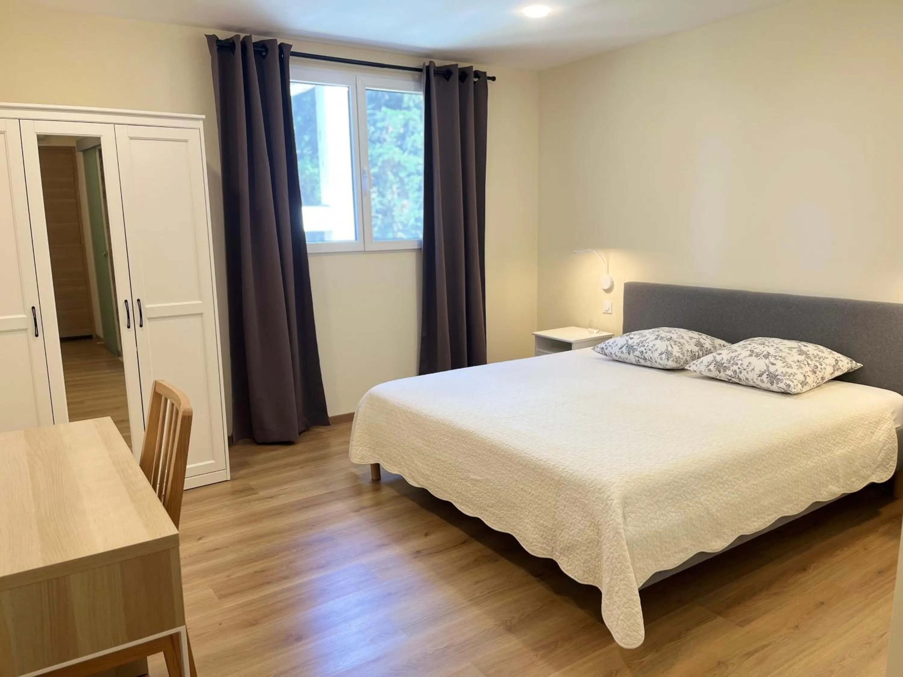 Bed in Grand Tamaris Hosting