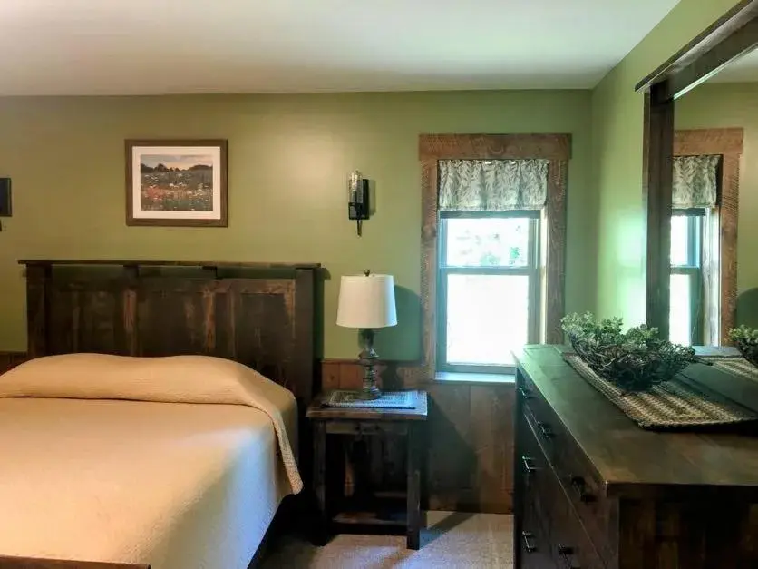 Bed in Sojourner's Lodge & Log Cabin Suites Bed in Sojourner's Lodge & Log Cabin Suites