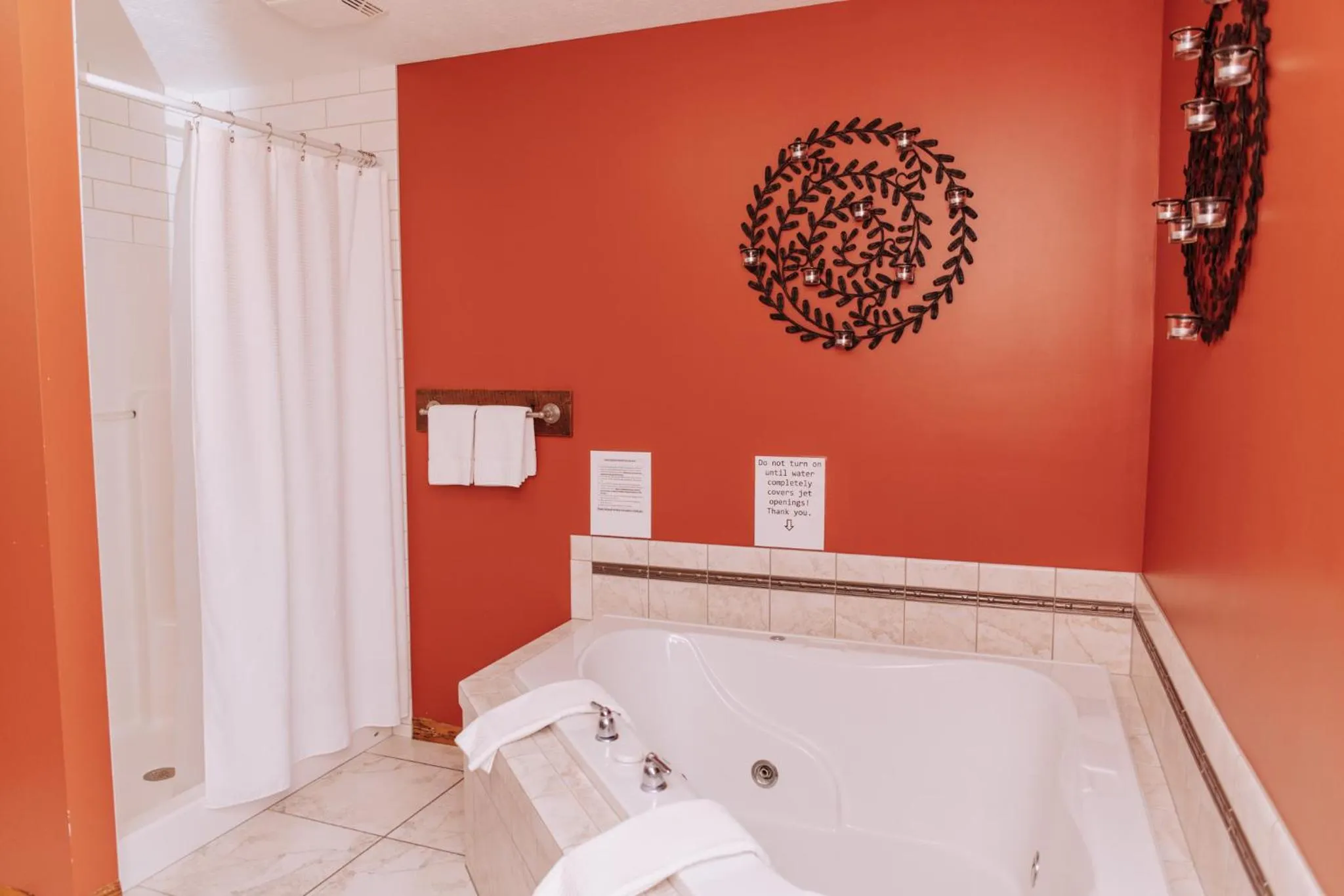 Bed in Sojourner's Lodge & Log Cabin Suites