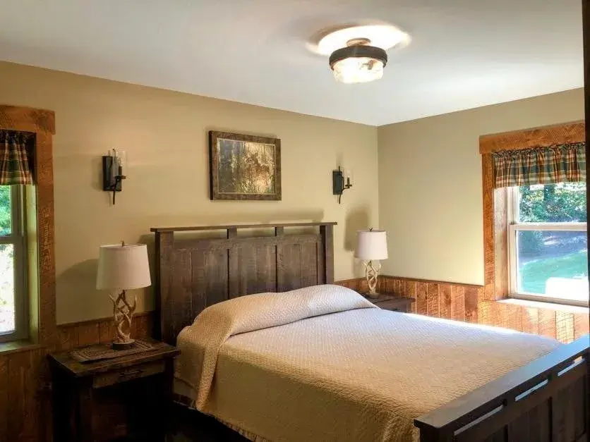 Bed in Sojourner's Lodge & Log Cabin Suites Bed in Sojourner's Lodge & Log Cabin Suites