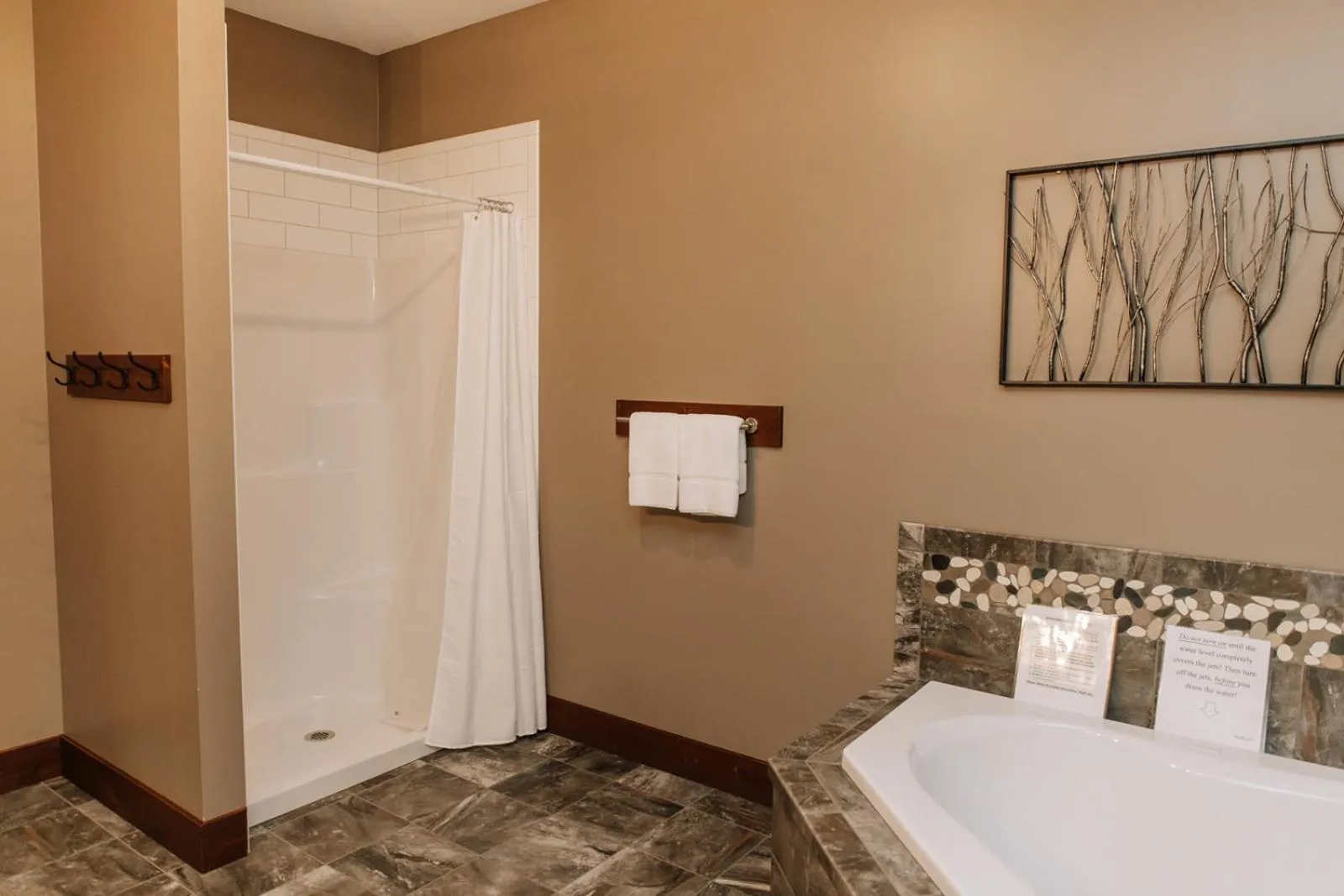 Bed in Sojourner's Lodge & Log Cabin Suites