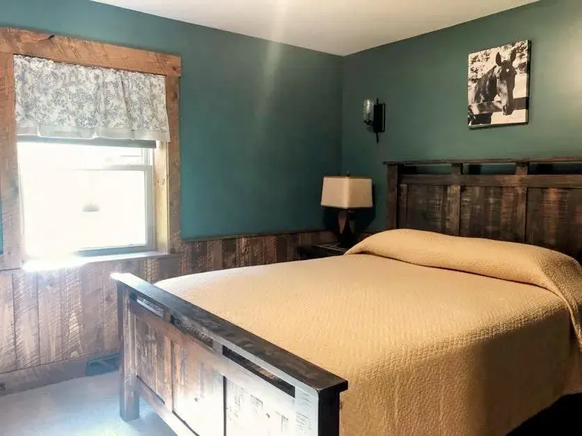 Bed in Sojourner's Lodge & Log Cabin Suites Bed in Sojourner's Lodge & Log Cabin Suites