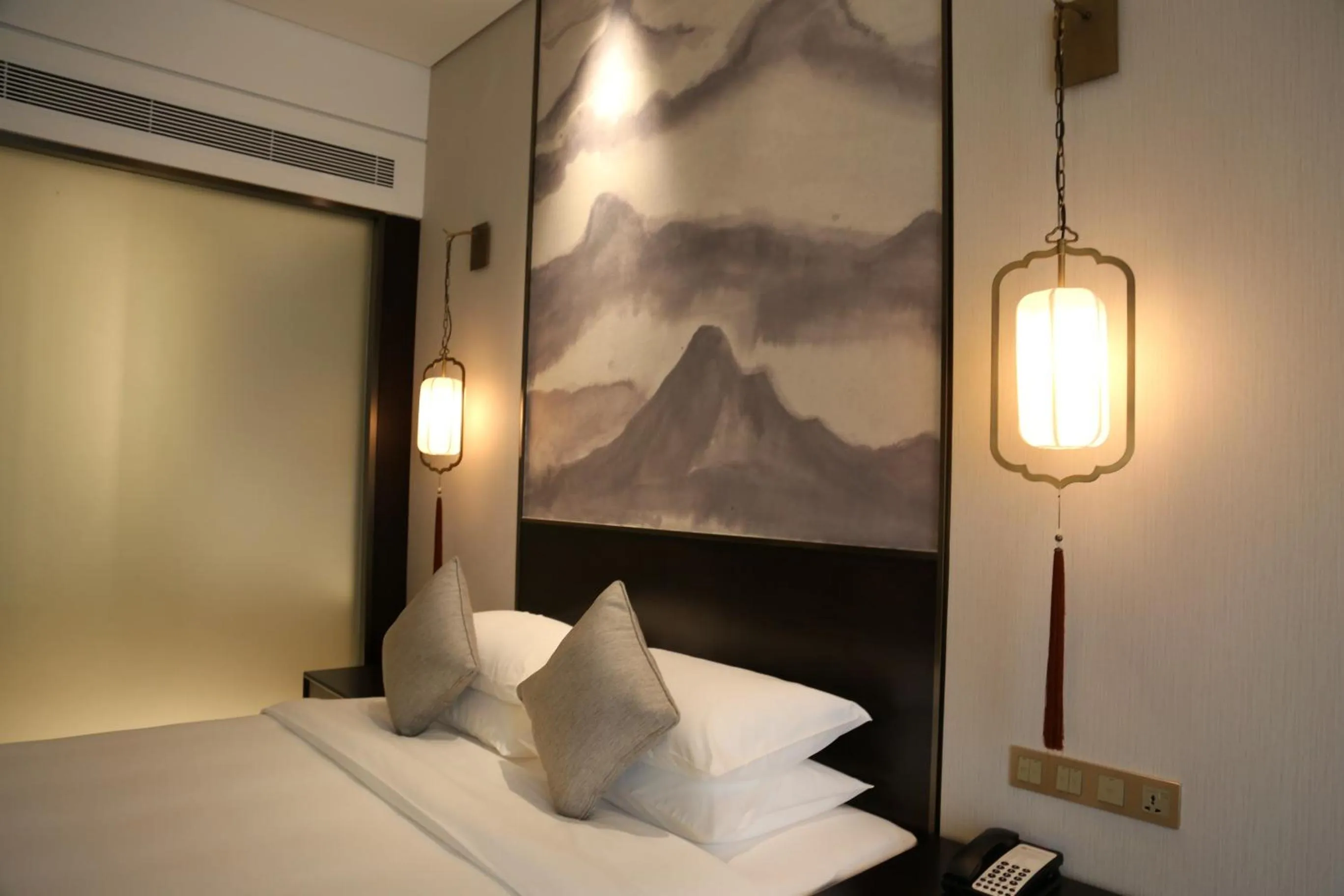 Bed in Amitabha Hotel (Fuzhou Pushang)
