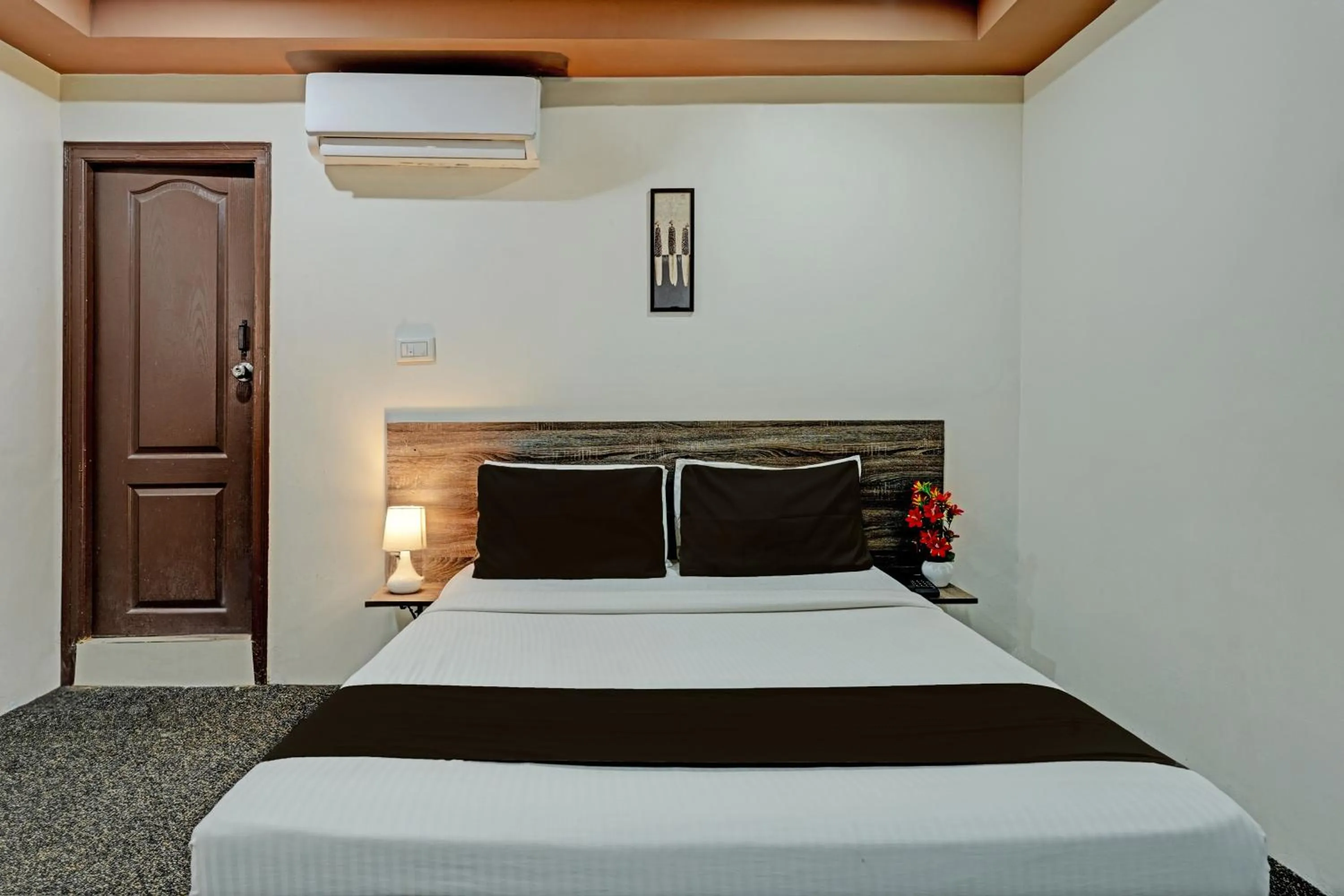 Bedroom in Hotel O Sri Sai sevalal comfort's