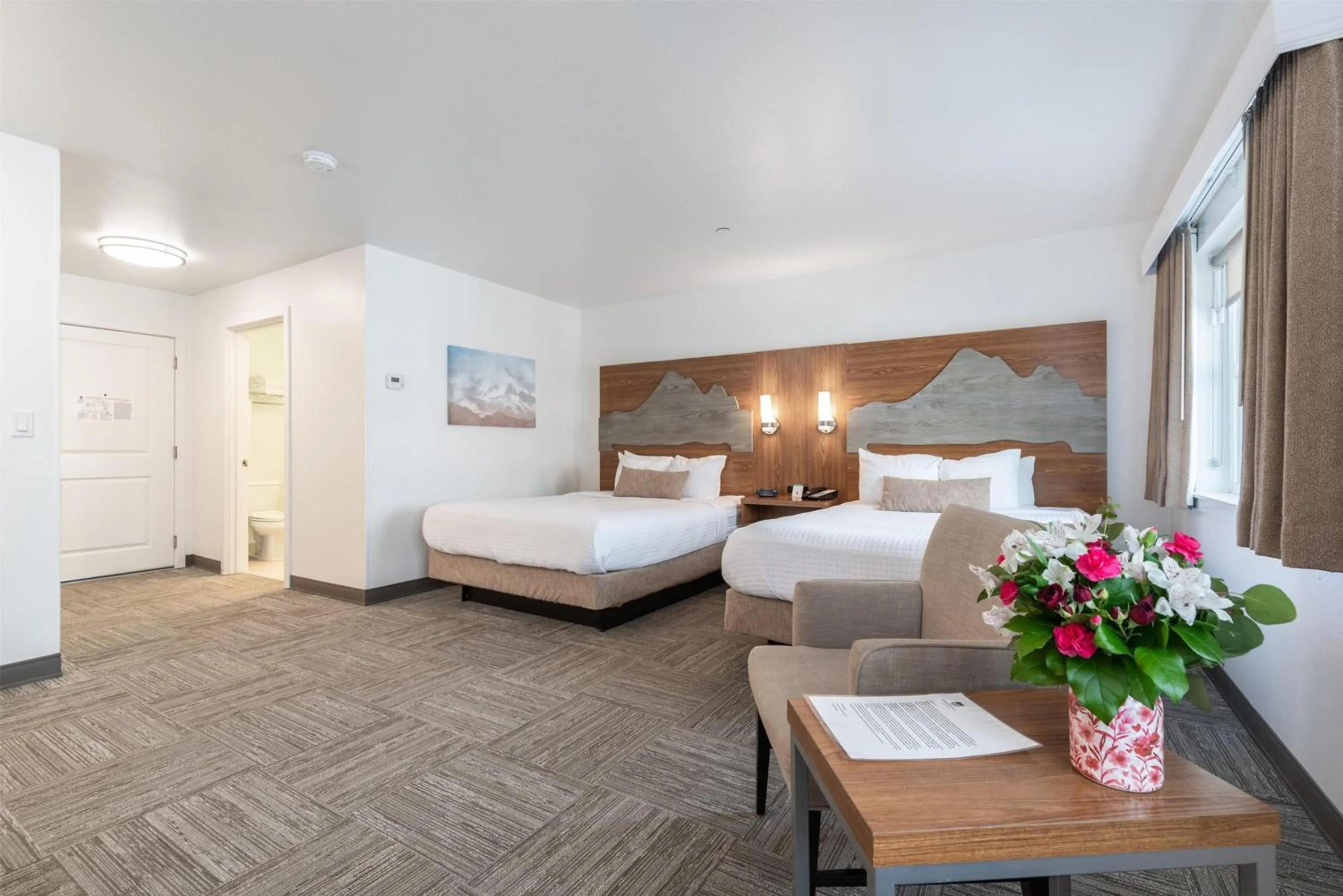 Bedroom, Bed in Marshall Suites Bainbridge Island, SureStay Collection by BW