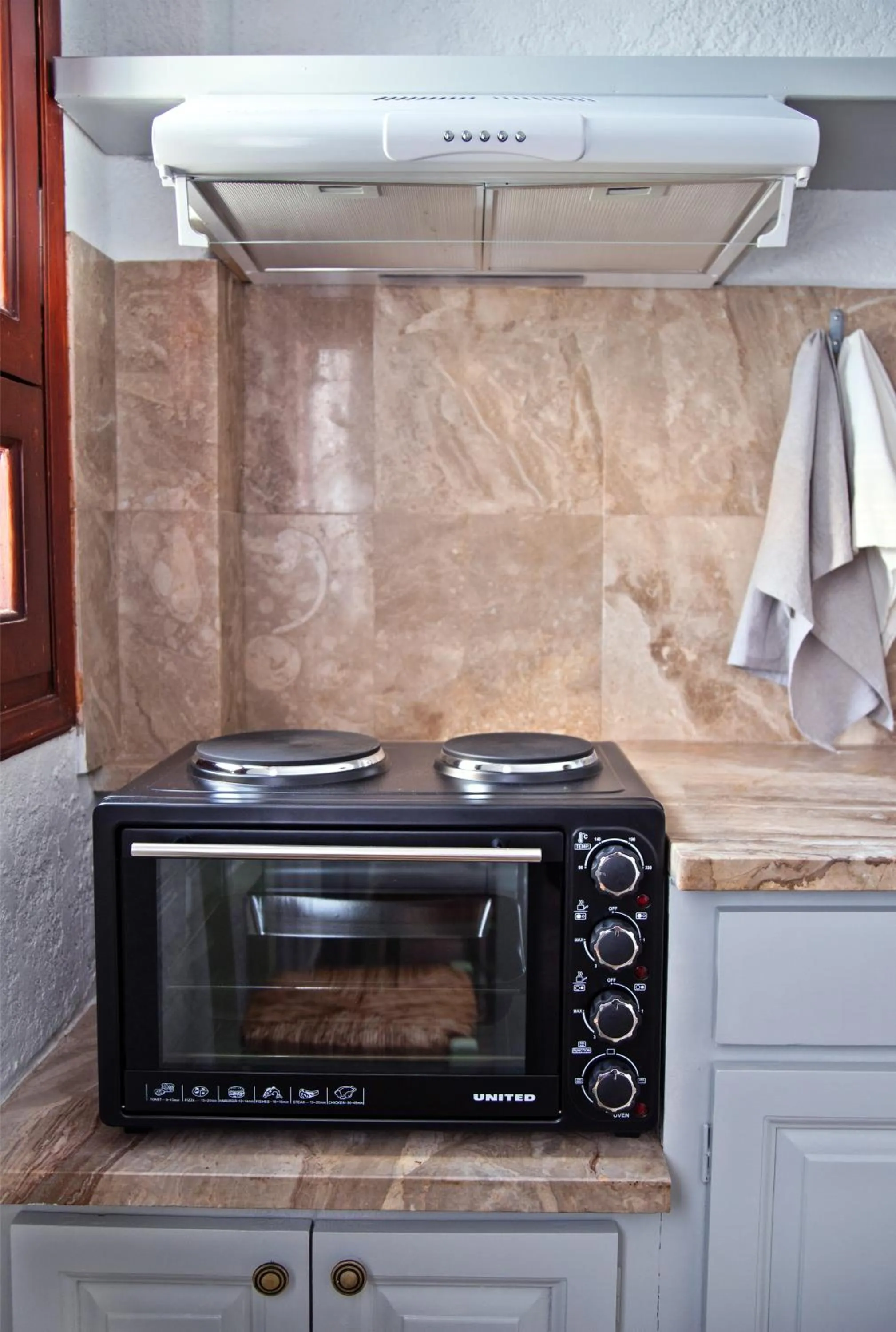 Kitchen or kitchenette in New Aurora Apts Studios