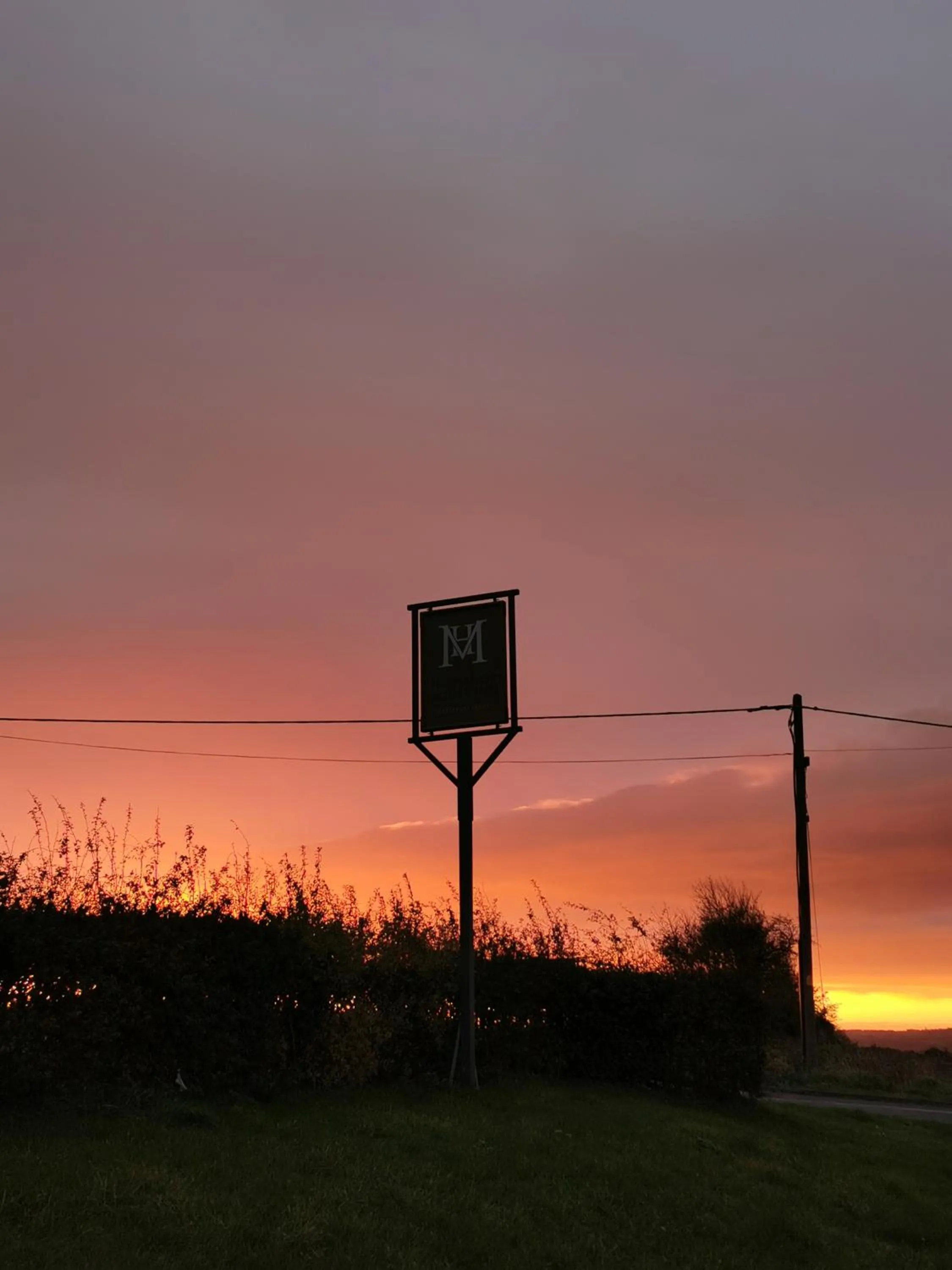 Property logo or sign in The Manor House Inn