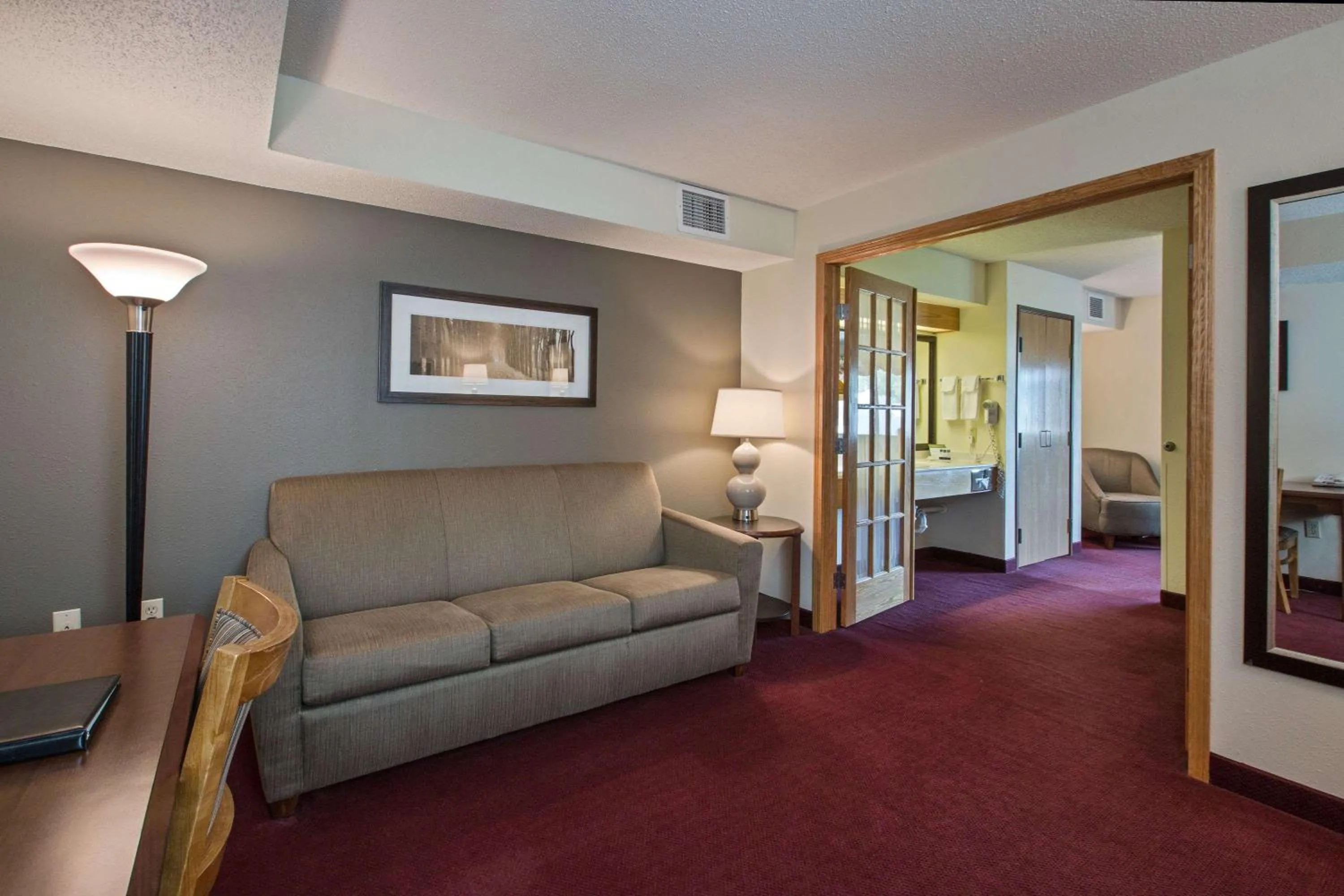Living room in AmericInn by Wyndham Iowa Falls