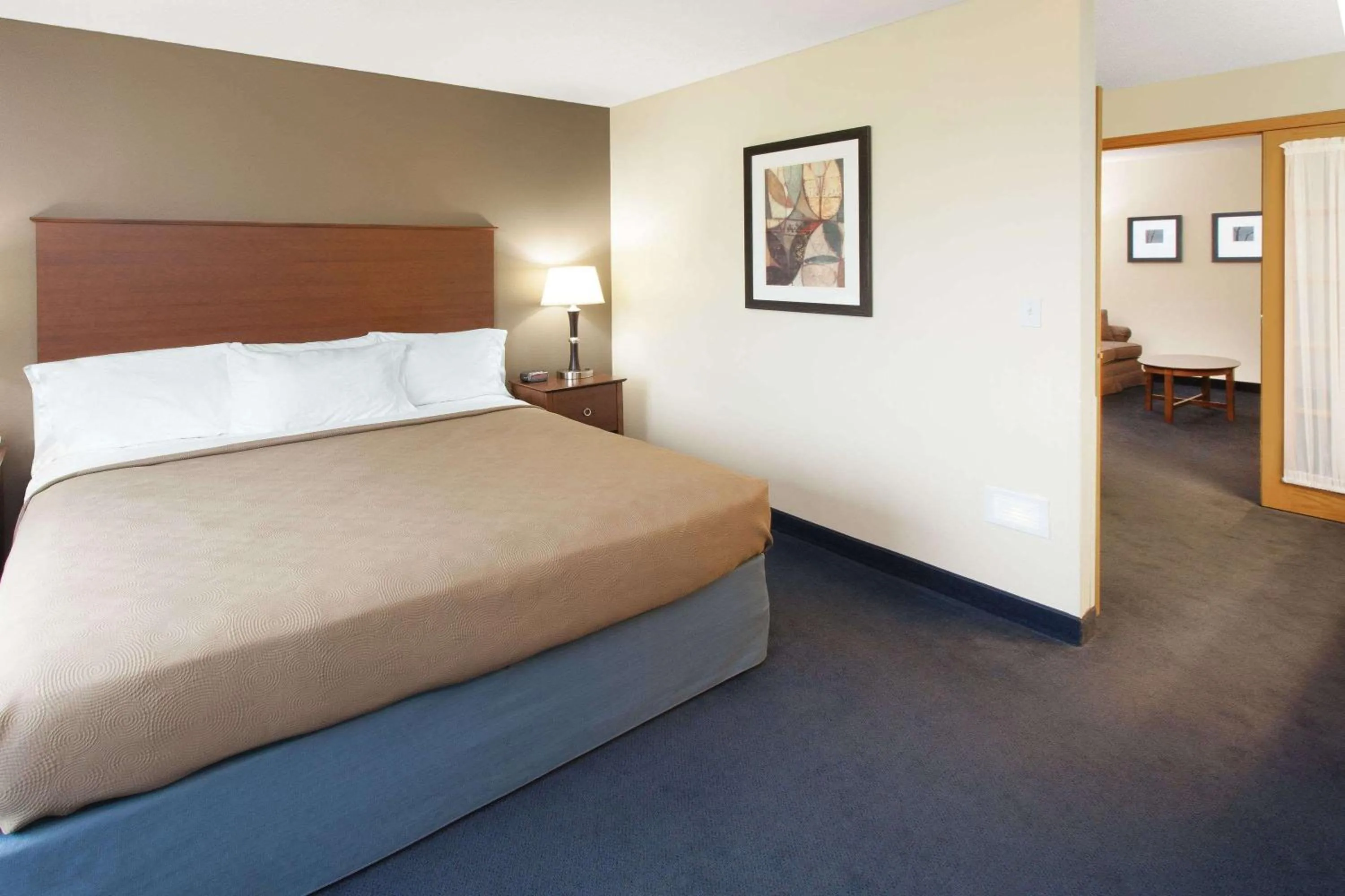 Bed in AmericInn by Wyndham Webster City