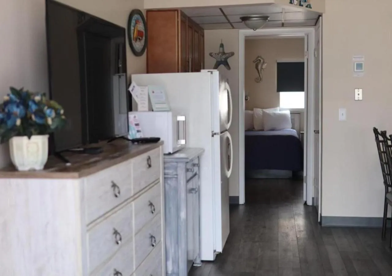 kitchen, Bed in Acacia Beachfront Resort