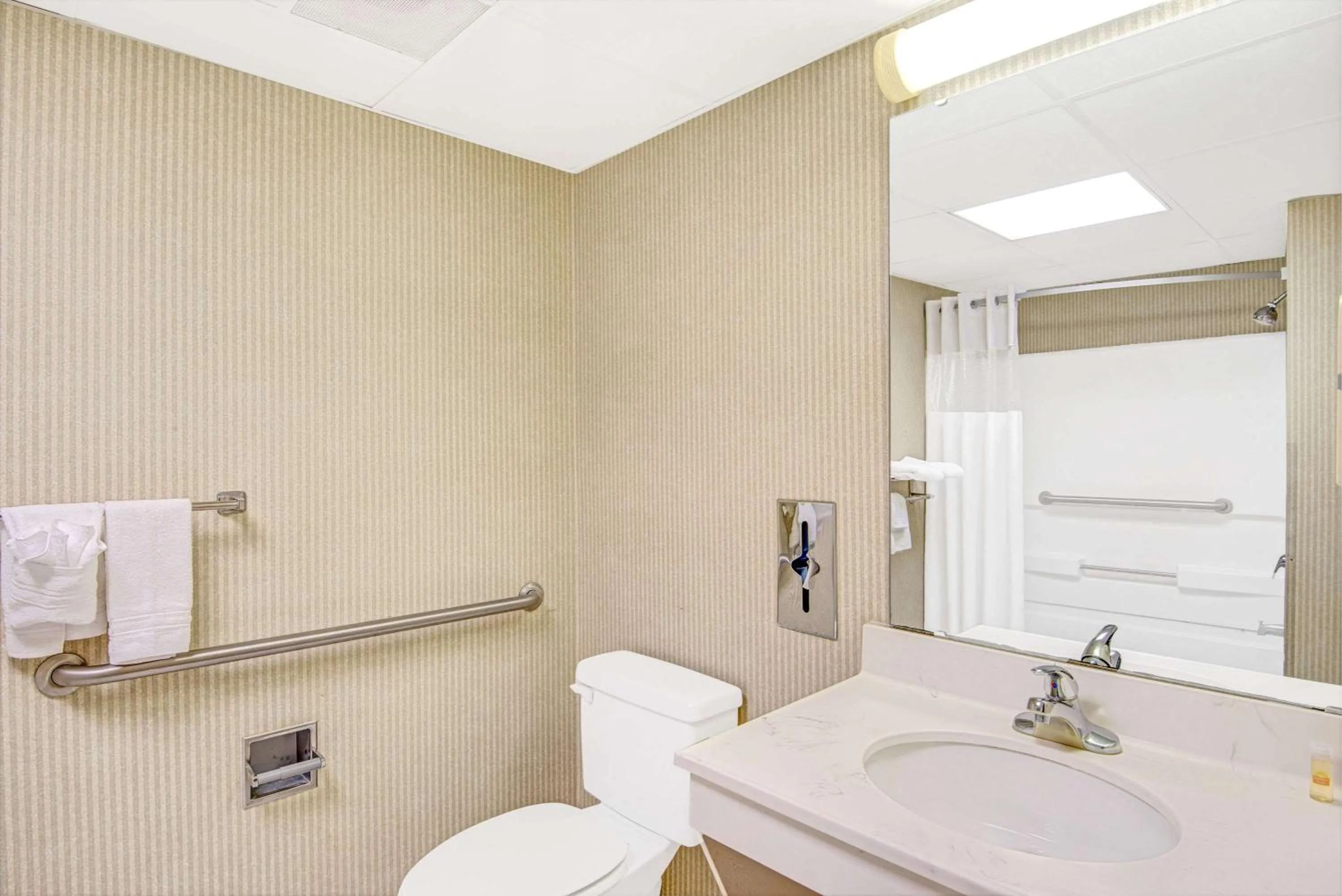 Bathroom in Days Inn by Wyndham Louisburg