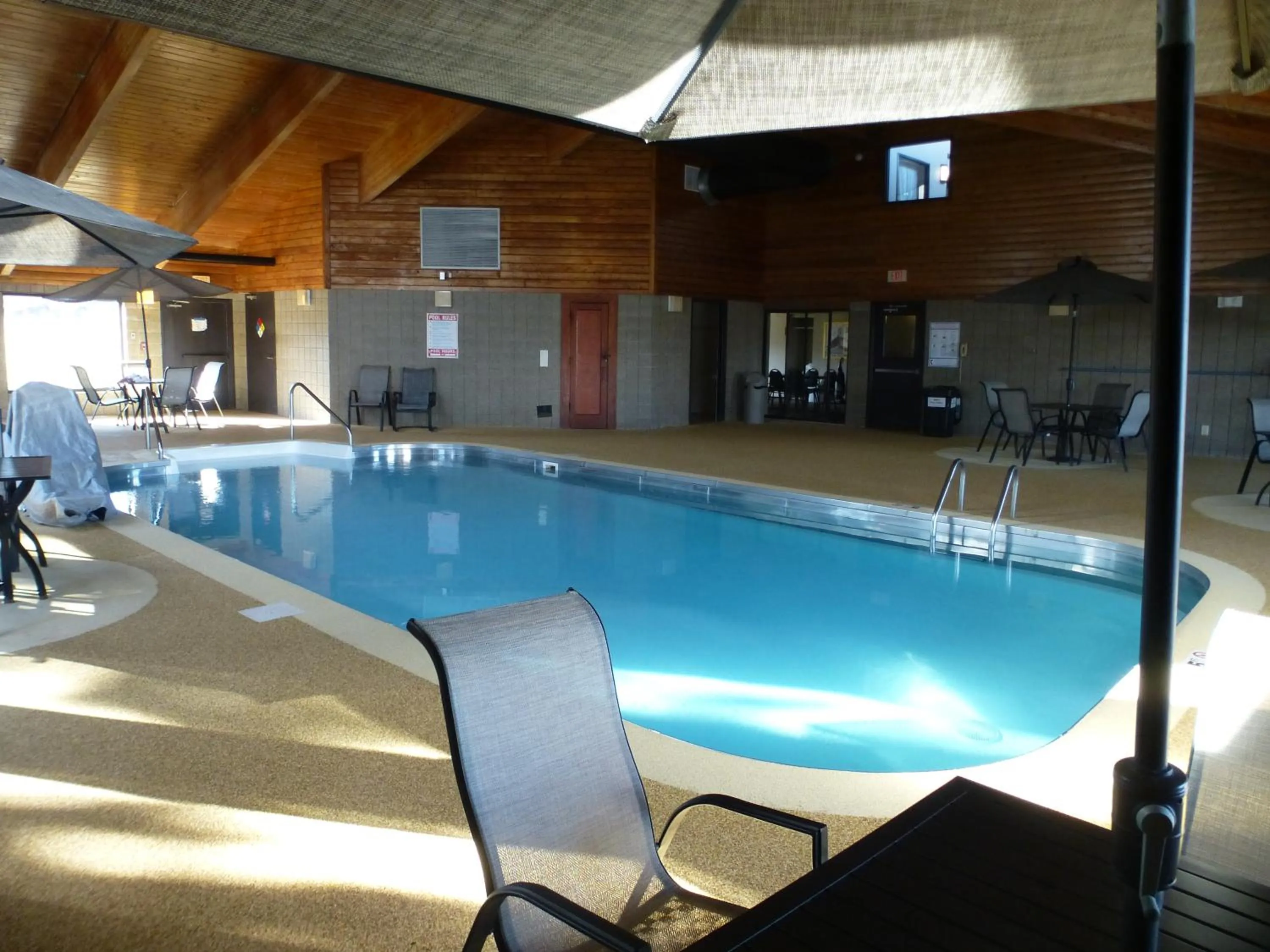 Swimming pool in AmericInn by Wyndham Mitchell