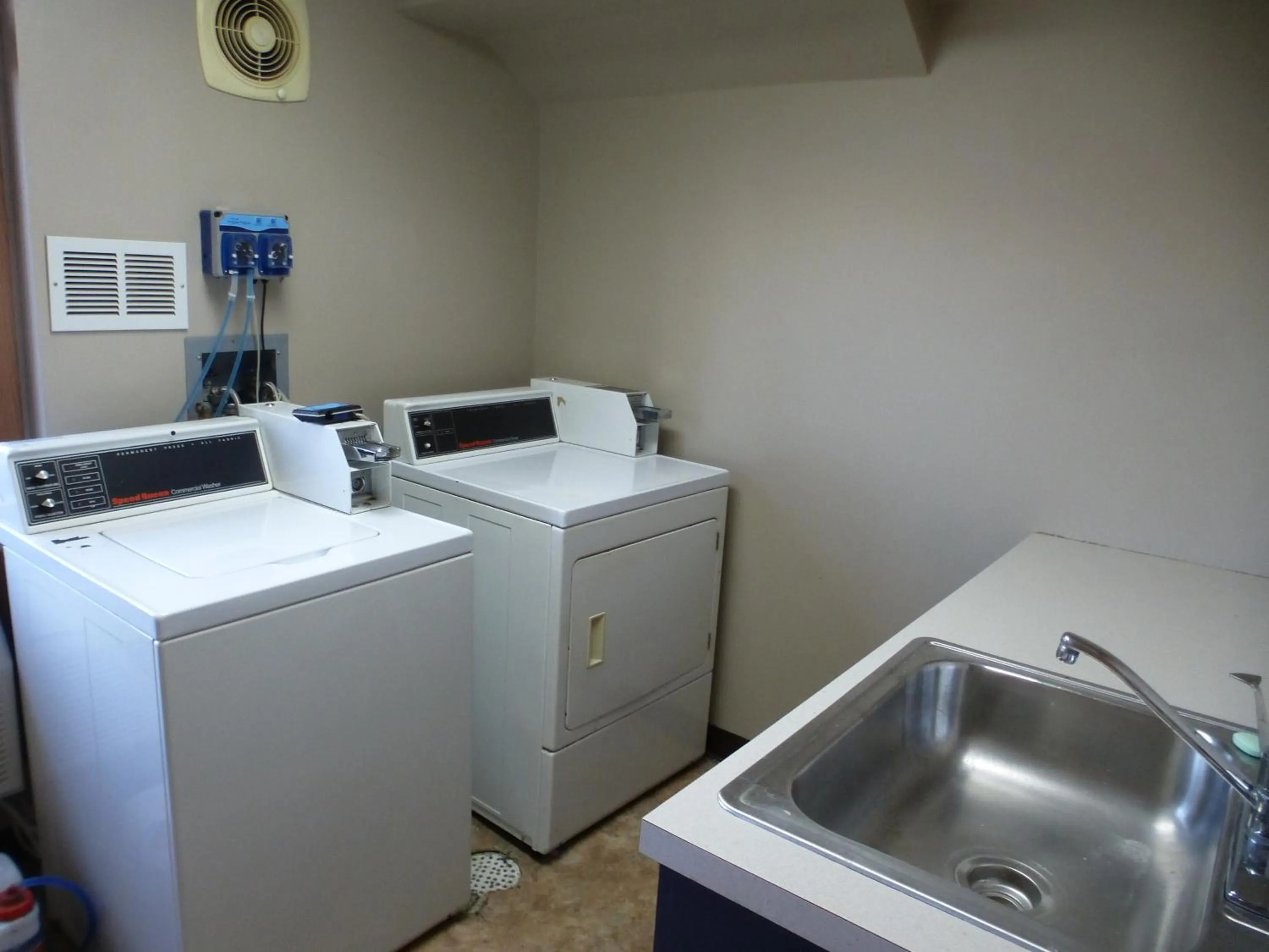 laundry in AmericInn by Wyndham Mitchell