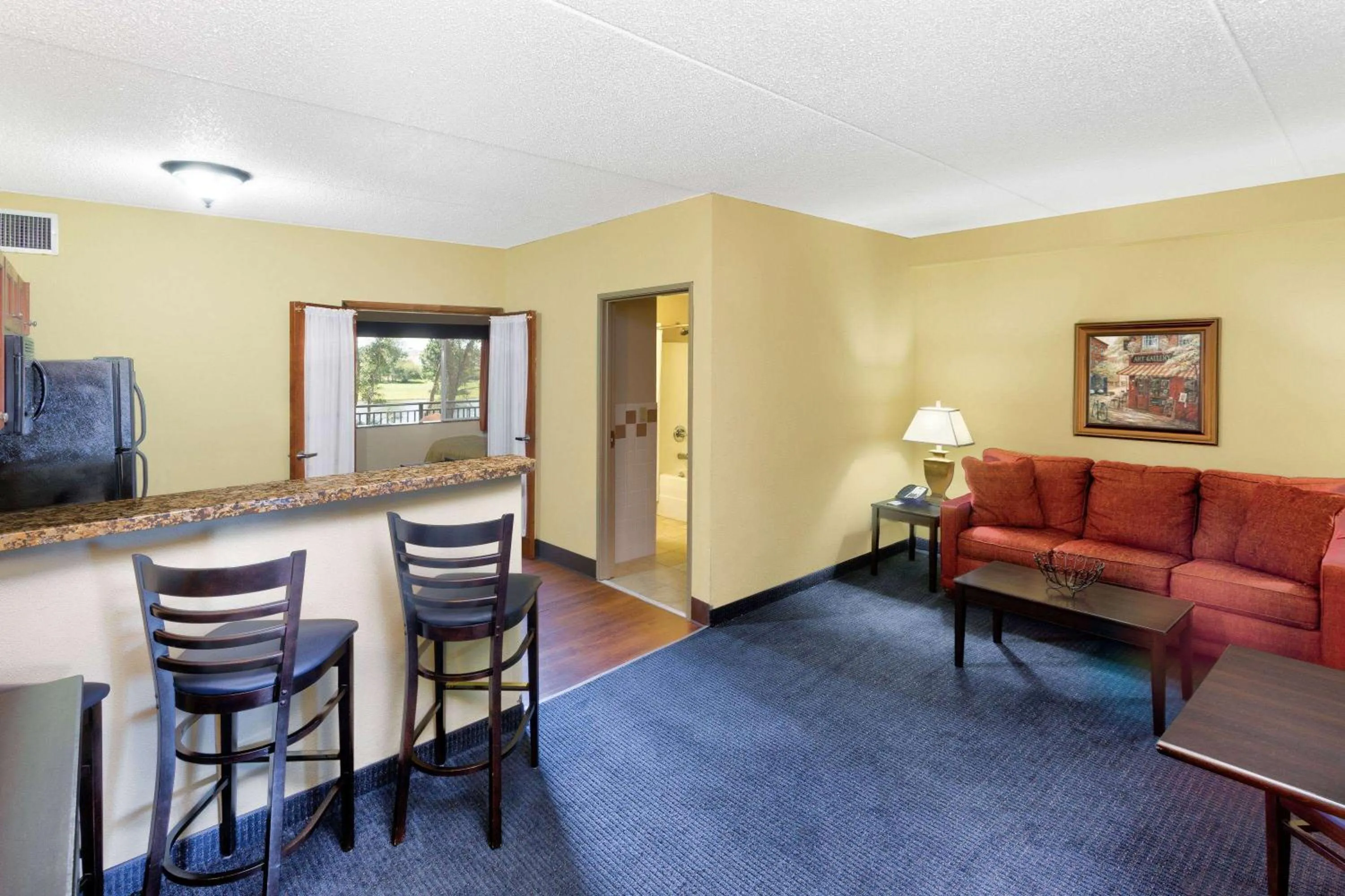 Bed in AmericInn by Wyndham Vidalia