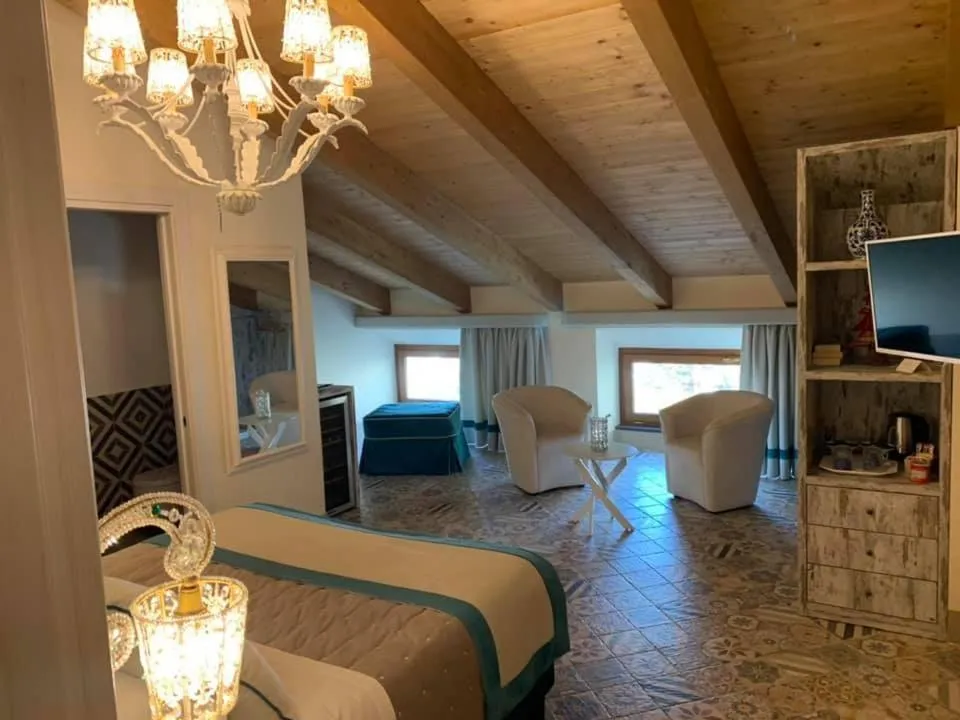 Bed in DON GIULIO LUXURY ROOMS jacuzzi