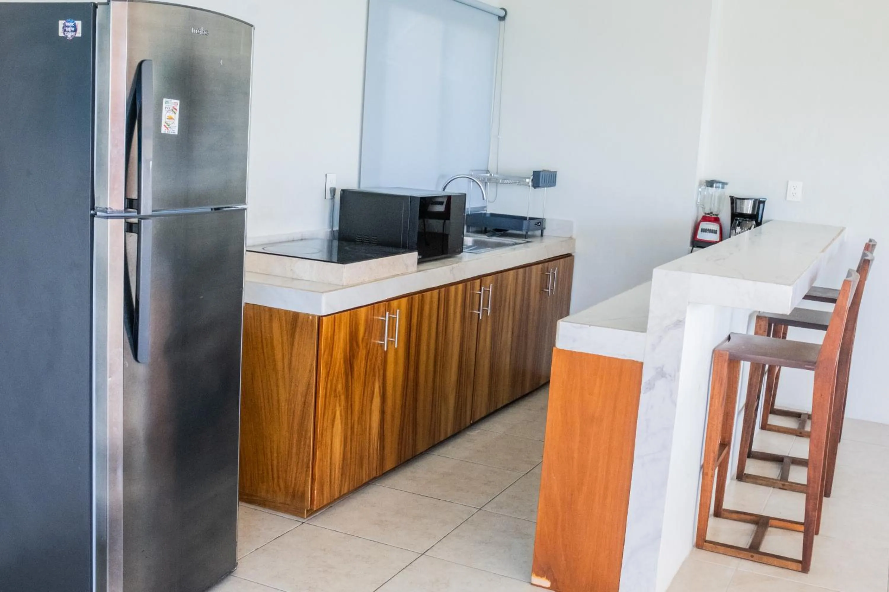 kitchen in Cuxos Hotel Beachfront