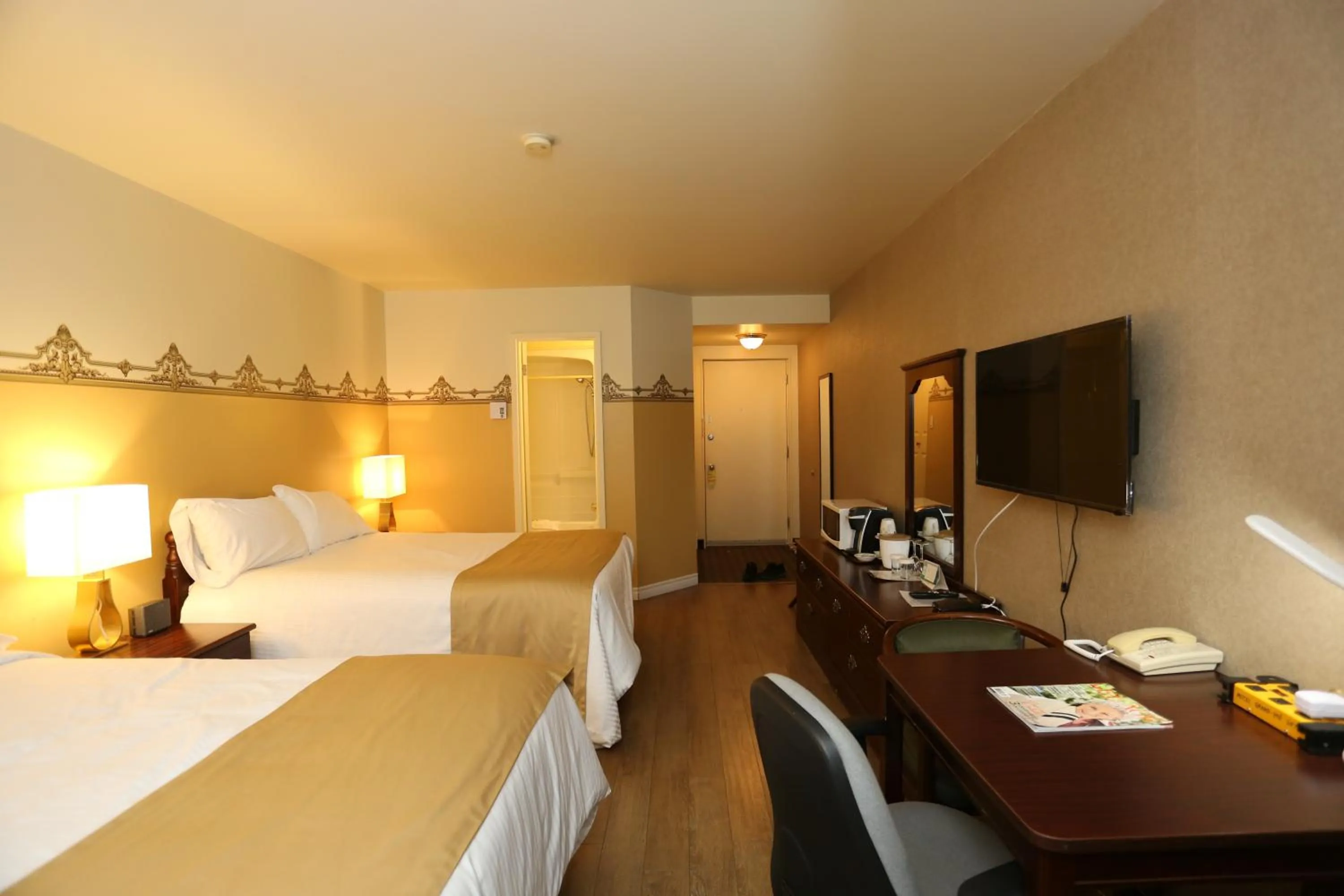 Bed in Motel Grand-Pré Inc