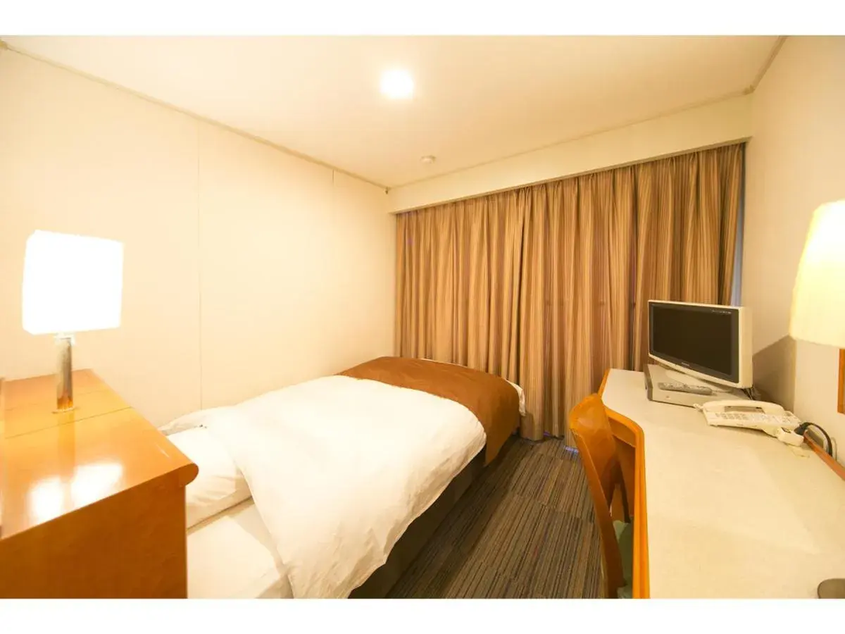 Bed in Hyper-inn Takamatsu Ekimae Bed in Hyper-inn Takamatsu Ekimae