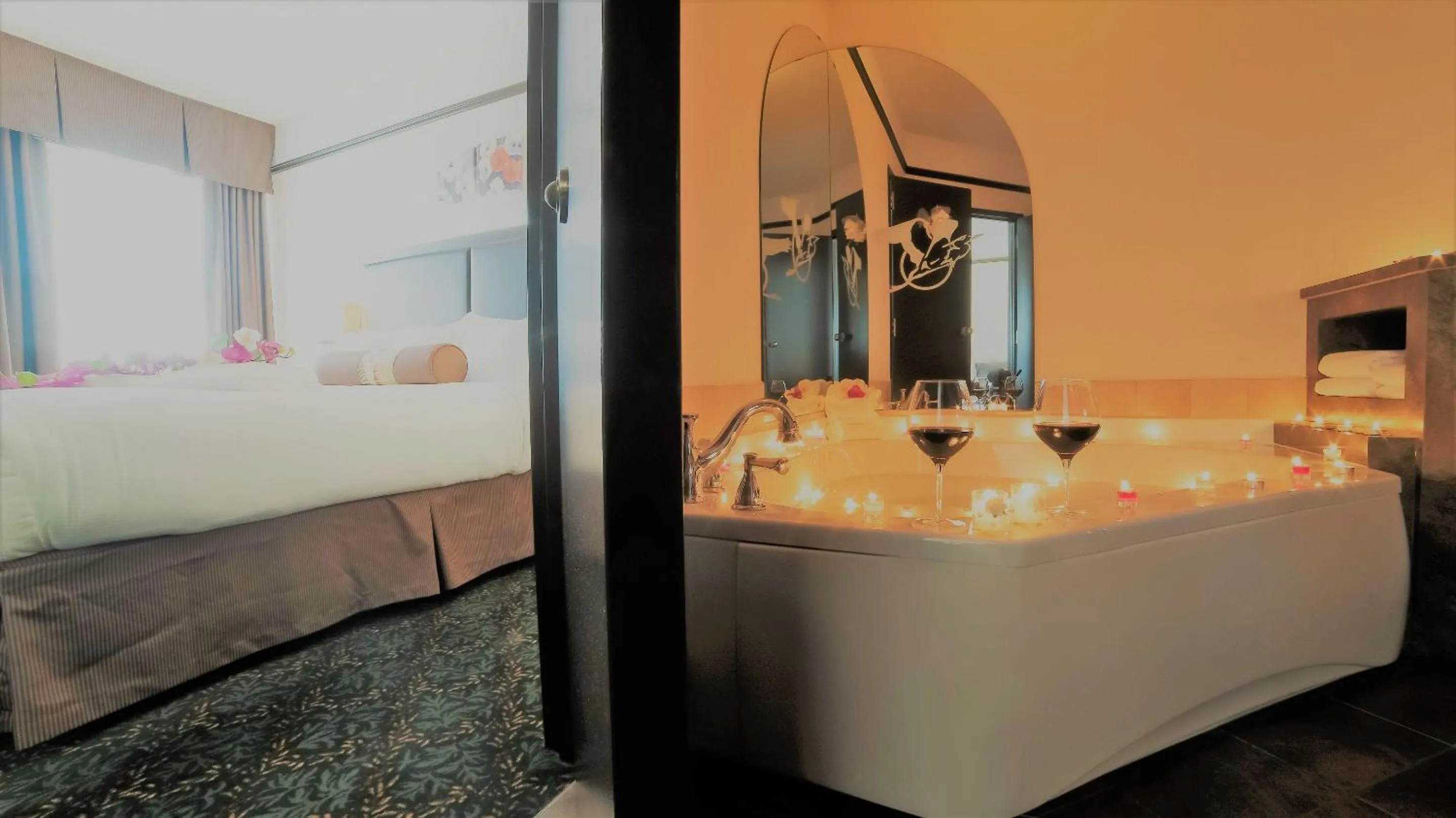 Bed in L'Escale Hôtel Suites