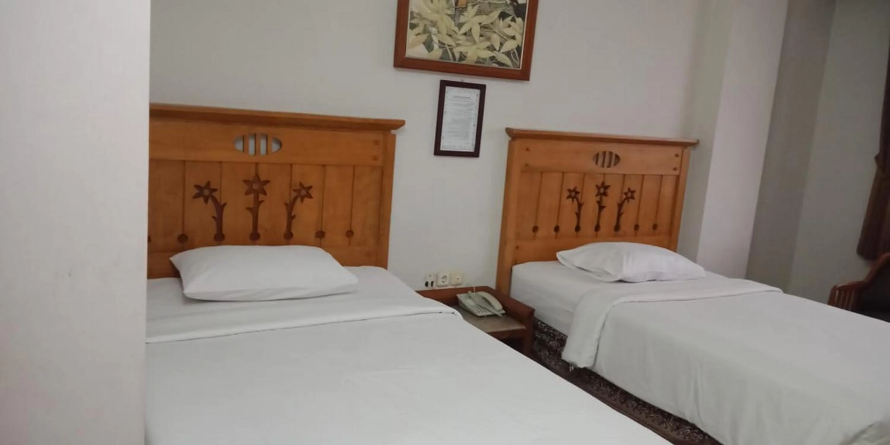 Bed in Hotel Yehezkiel Surapati Mitra RedDoorz