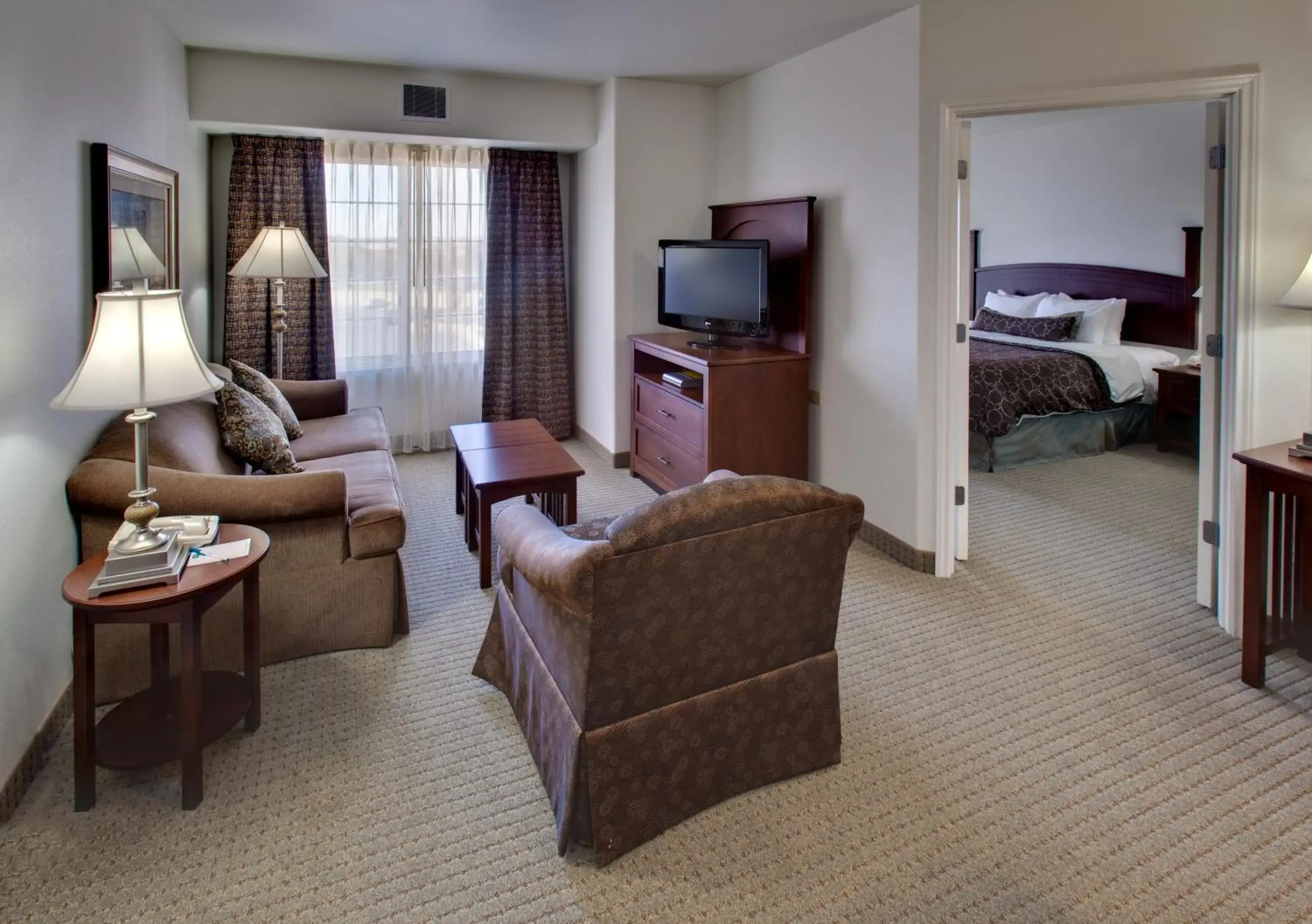 Living room, Bed in Staybridge Suites Rockford by IHG Living room, Bed in Staybridge Suites Rockford by IHG