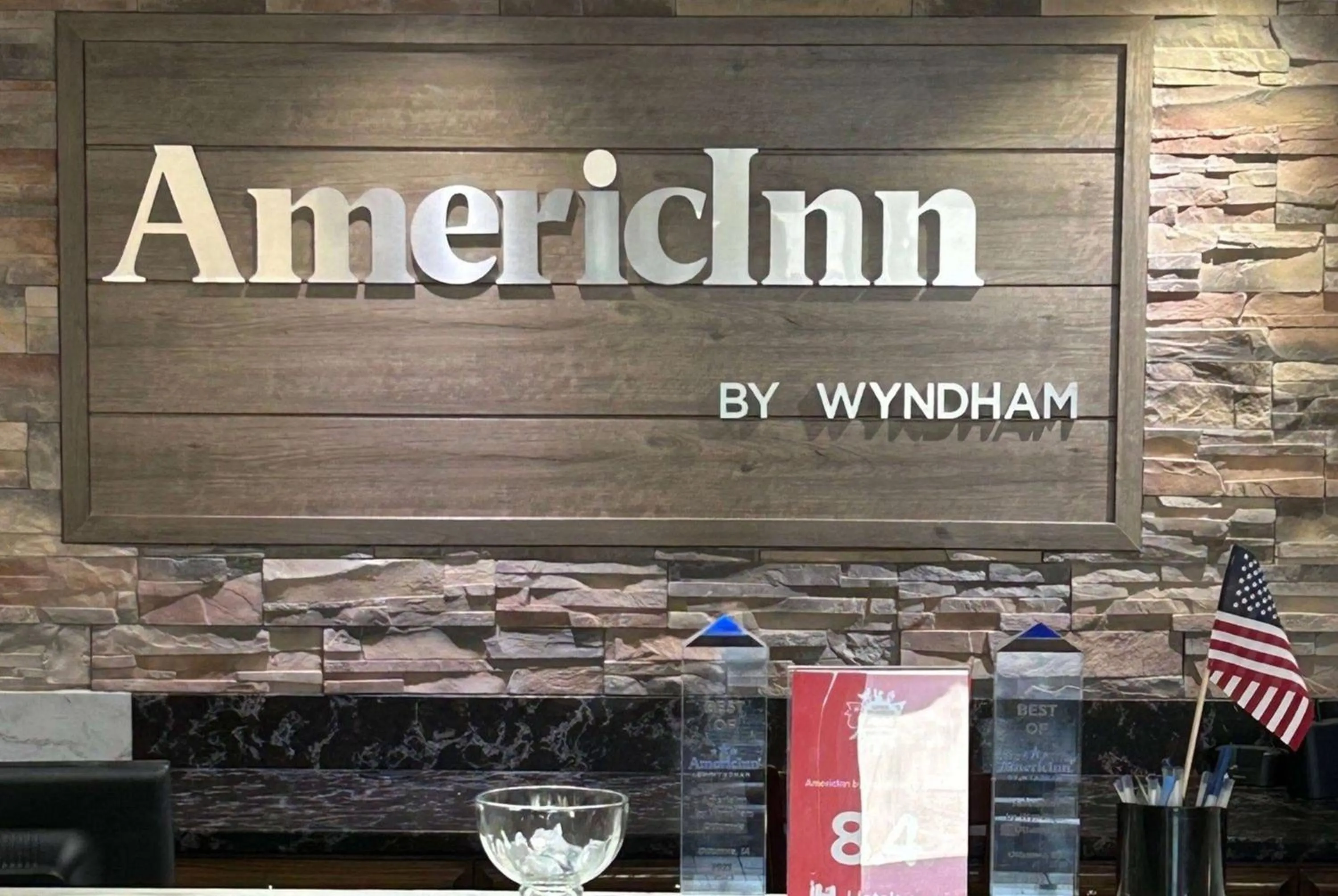 Property logo or sign in AmericInn by Wyndham Ottumwa