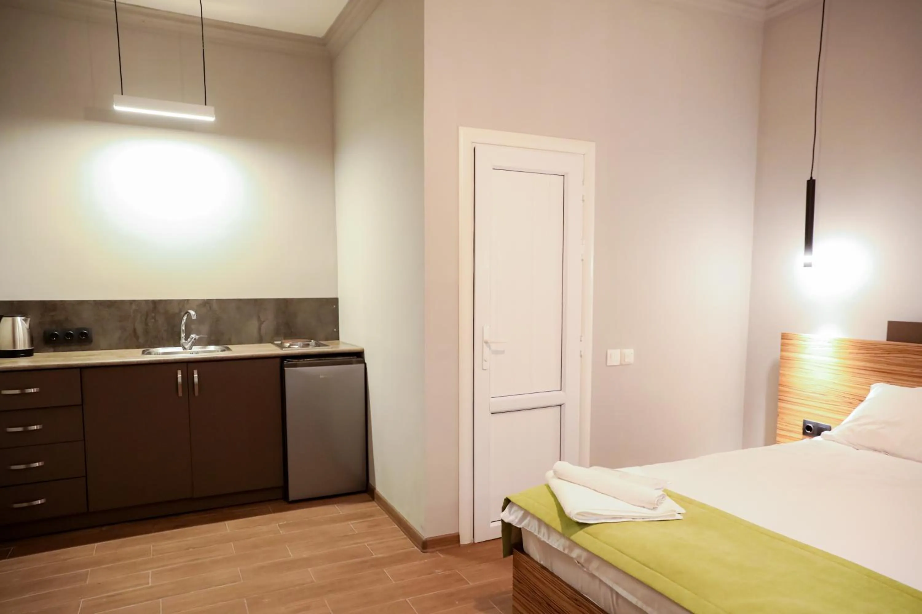 Kitchen or kitchenette, Bed in Garden Inn Resort Sevan