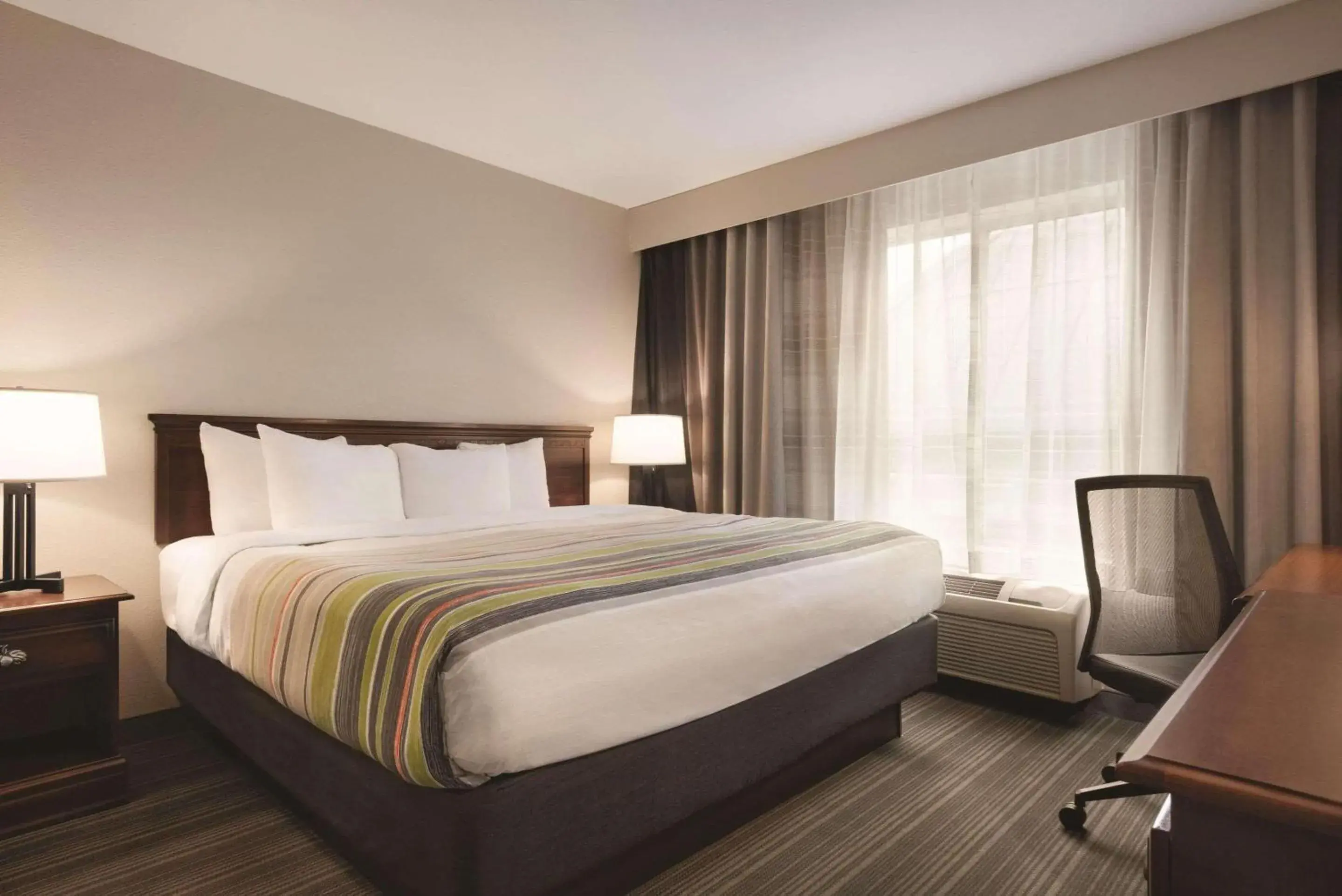 Bedroom, Bed in Country Inn & Suites by Radisson, Michigan City, IN Bedroom, Bed in Country Inn & Suites by Radisson, Michigan City, IN