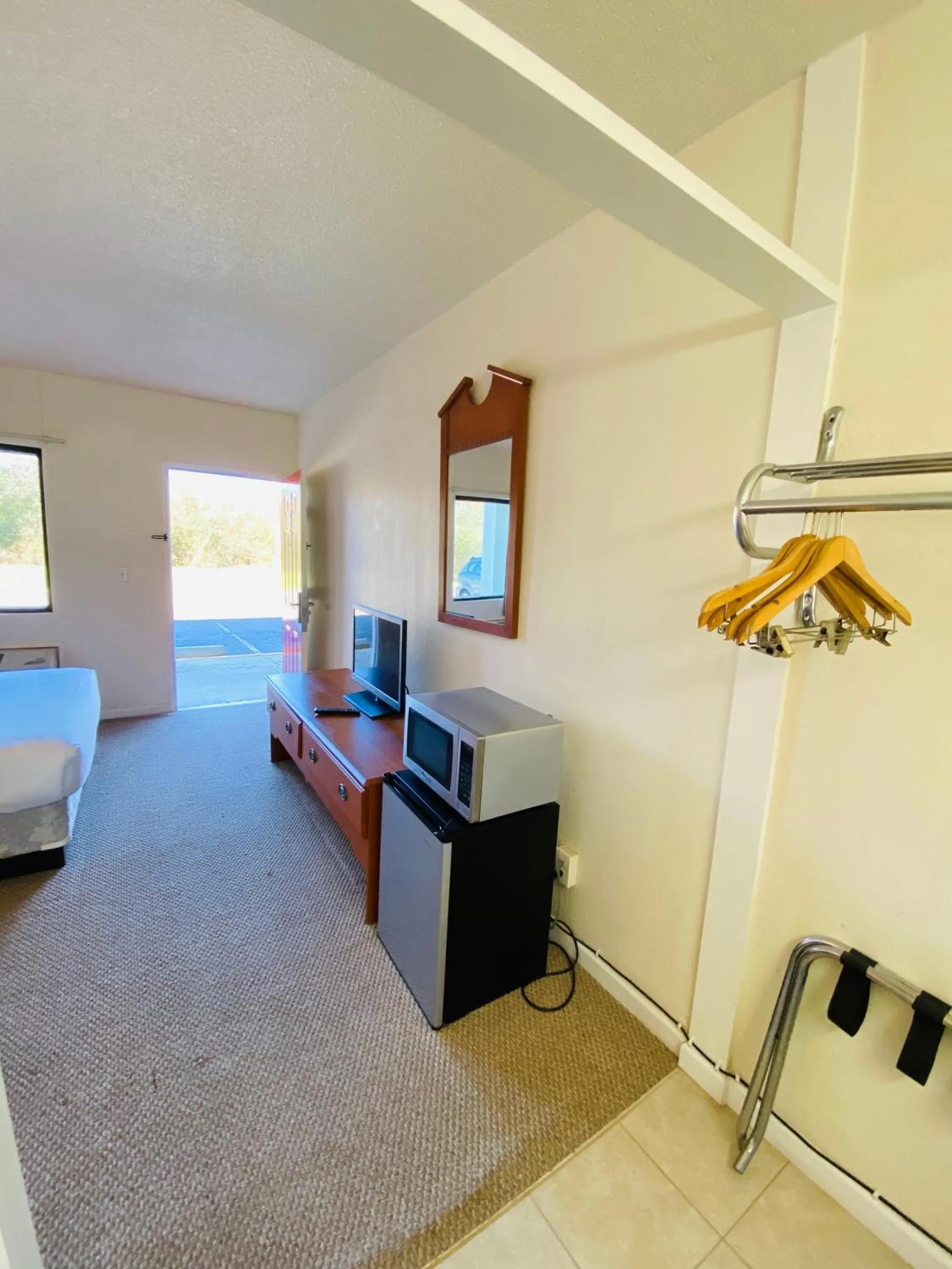 Bed in Traveler's Place Inn & Suites