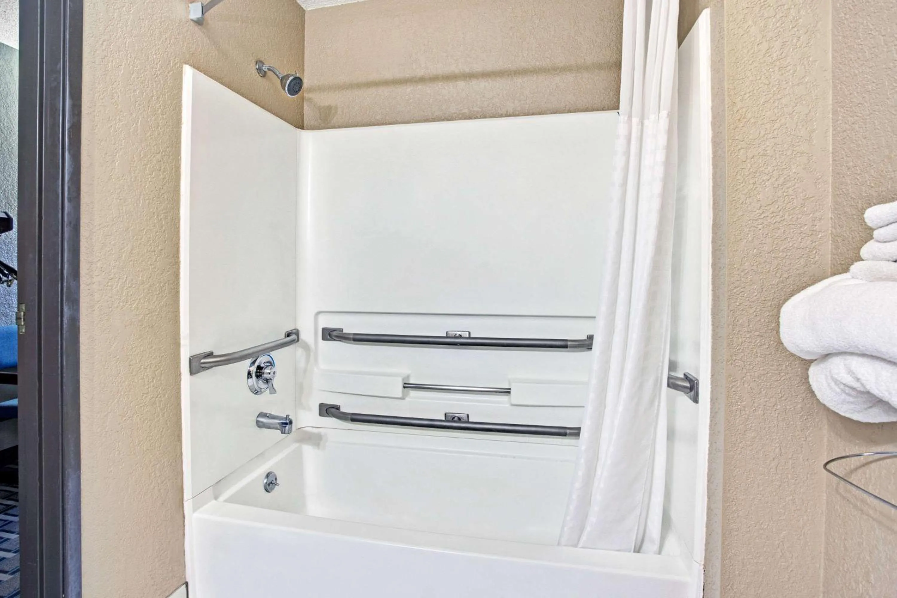 Bathroom in Super 8 by Wyndham Roseville/Detroit Area