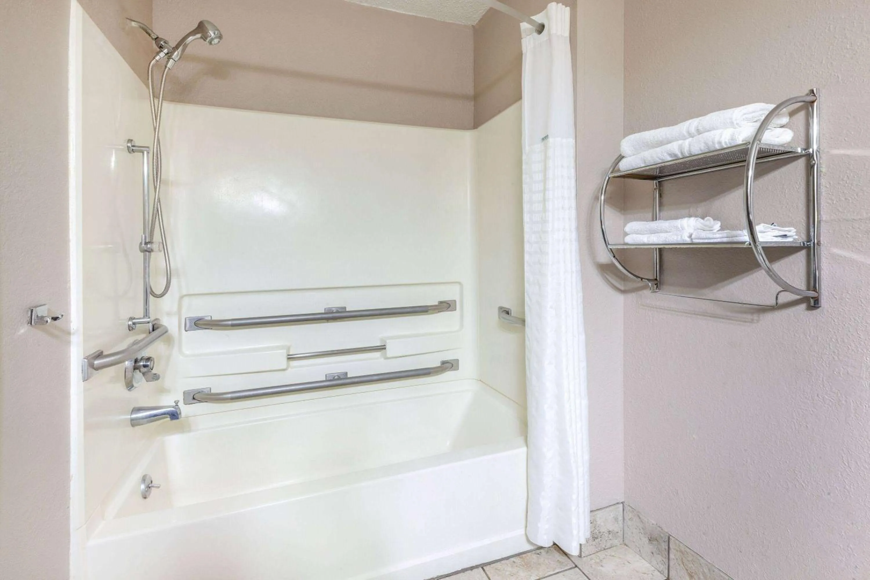 Bathroom in Super 8 by Wyndham Roseville/Detroit Area