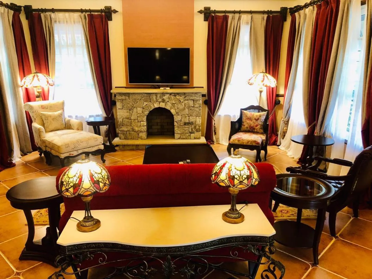 Seating area, Bed in Coorg Wilderness Resort & Spa