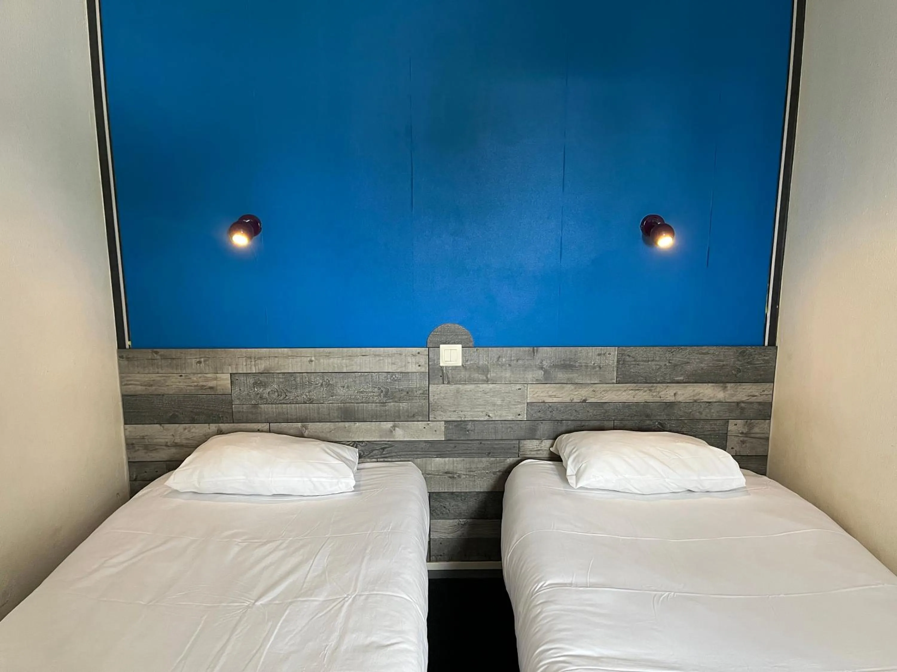 Bed in Kyriad Direct Macon Sud