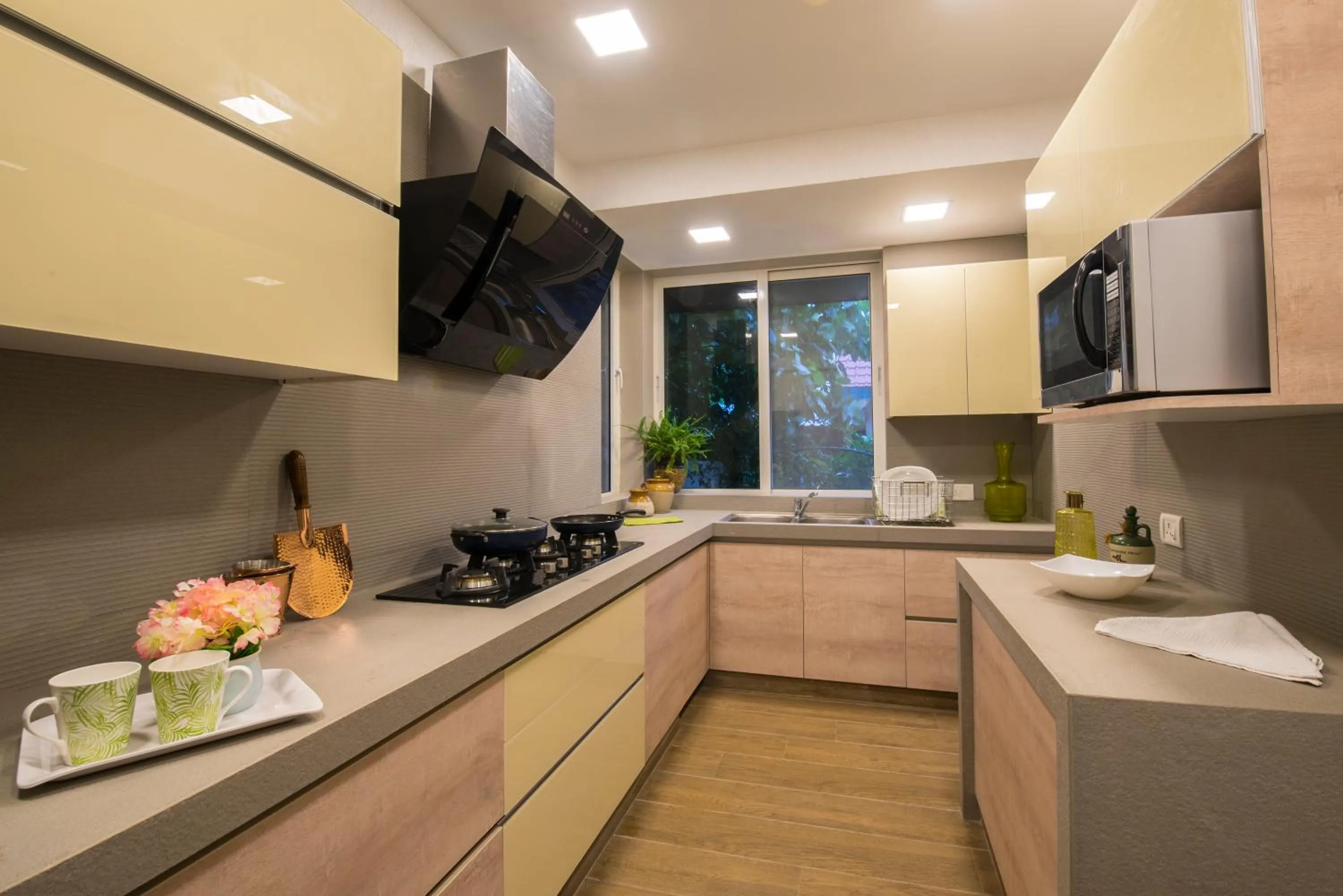 Kitchen or kitchenette in EL Lodge by StayVista - Pool, lawn, and a charming gazebo for your perfect getaway