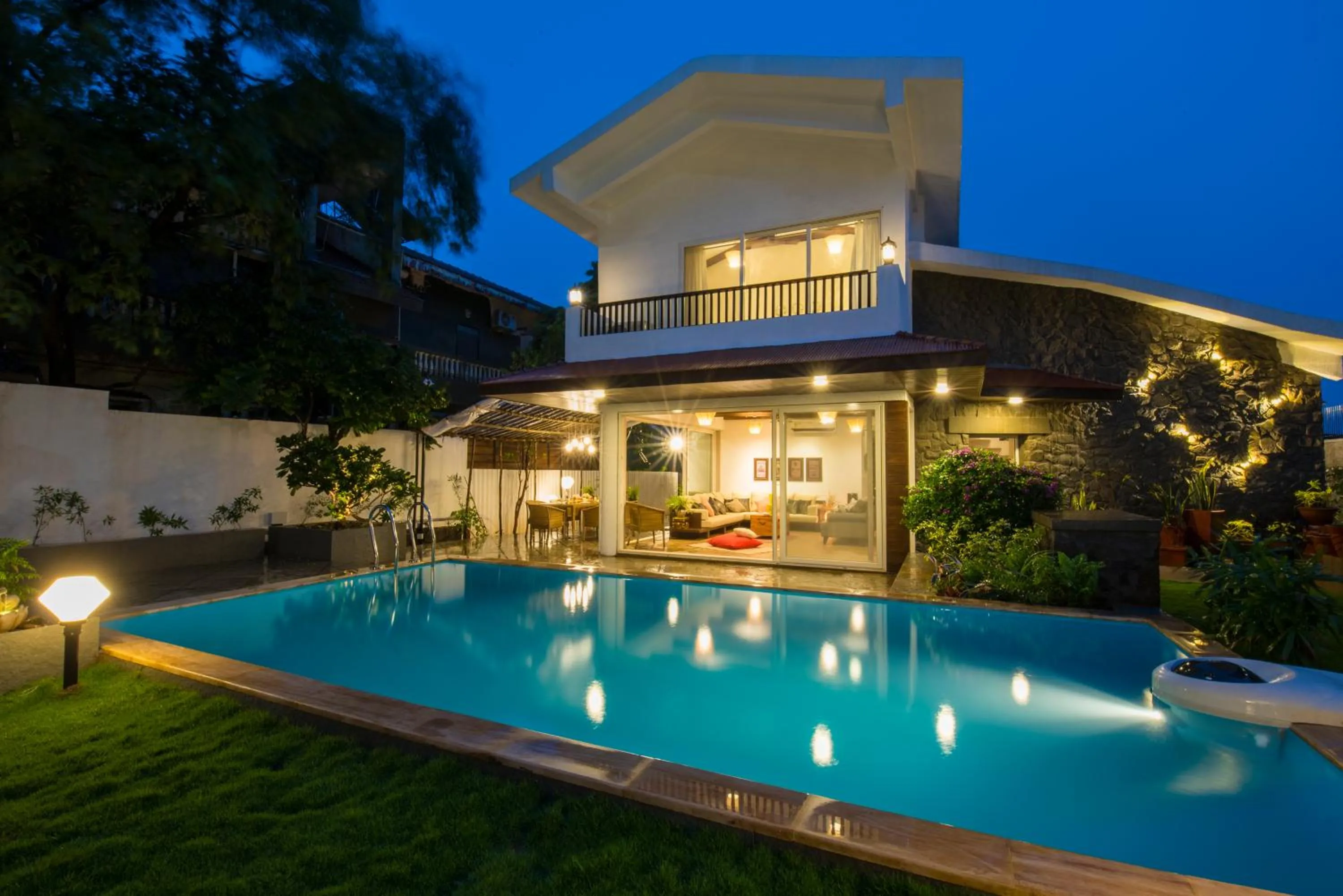 Swimming pool in EL Lodge by StayVista - Pool, lawn, and a charming gazebo for your perfect getaway